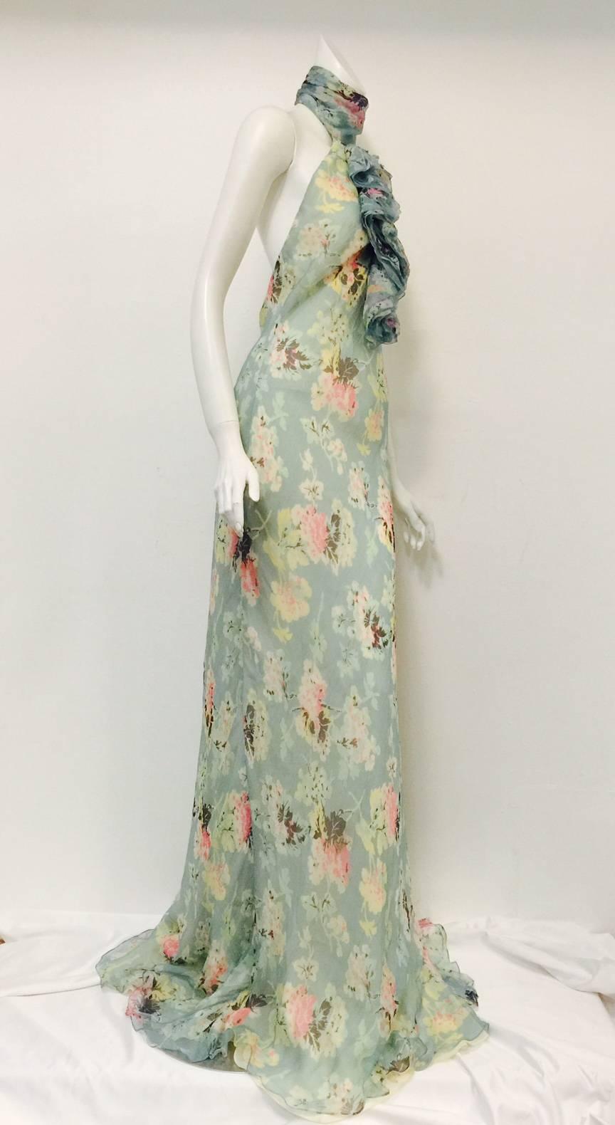 Ralph Lauren Collection Silk Bias Cut Halter Dress With Ruffles is worthy of any garden party!  Features exquisite sea foam blue silk with an exotic floral print allover, sensual bias-cut silhouette and halter neckline.  Backless?  But of course! 