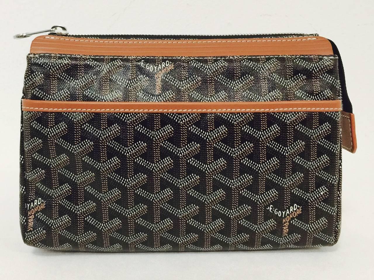 Goyard Cosmetic Bag is a must for any traveler!  Features black brown, tan and ivory coated 