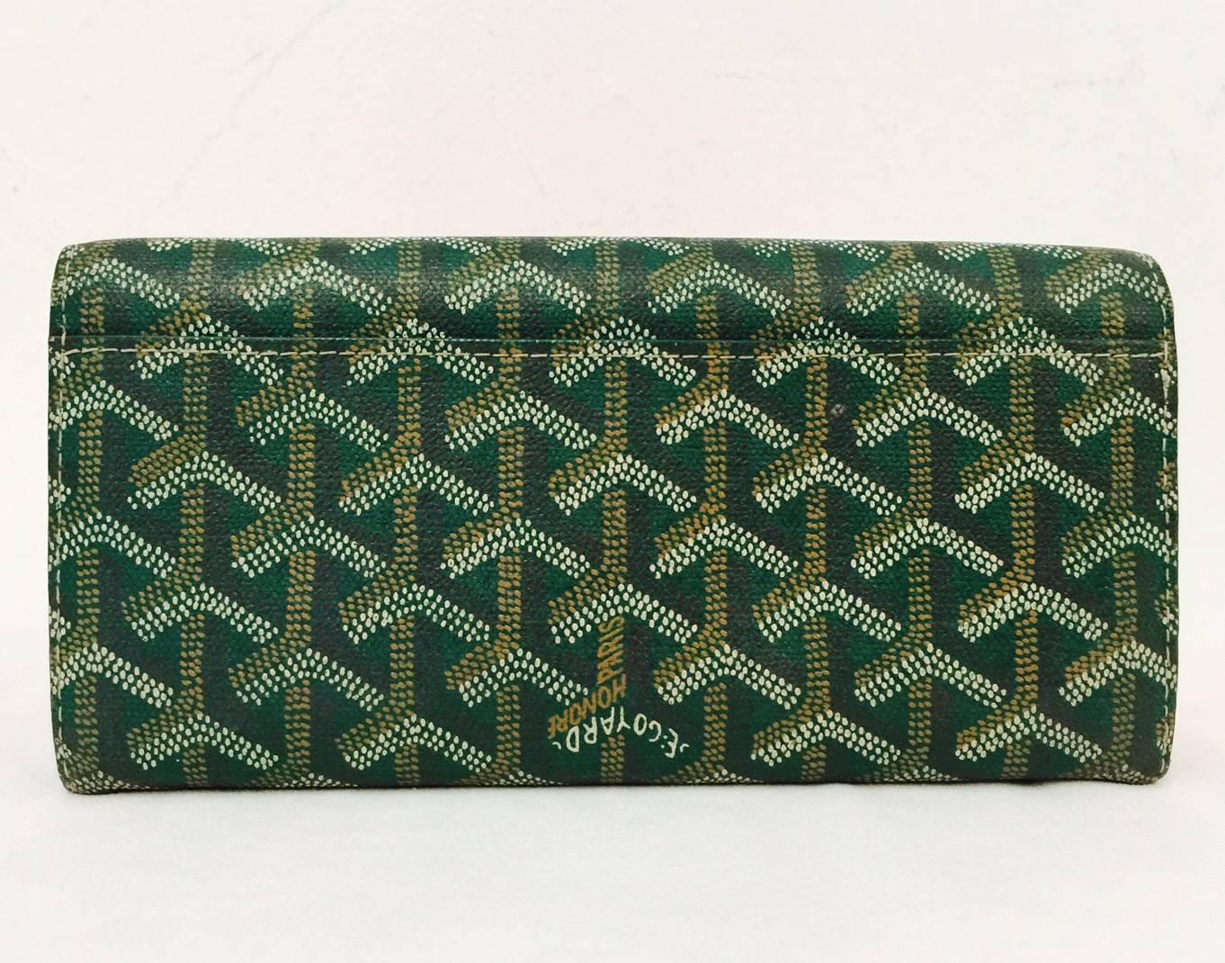 The undeniable quality and construction of Goyard's product lines illustrates why this house's history extends to the late 18th Century!  This luxurious wallet is crafted from signature Green multicolor hand-painted Goyardine coated canvas and has