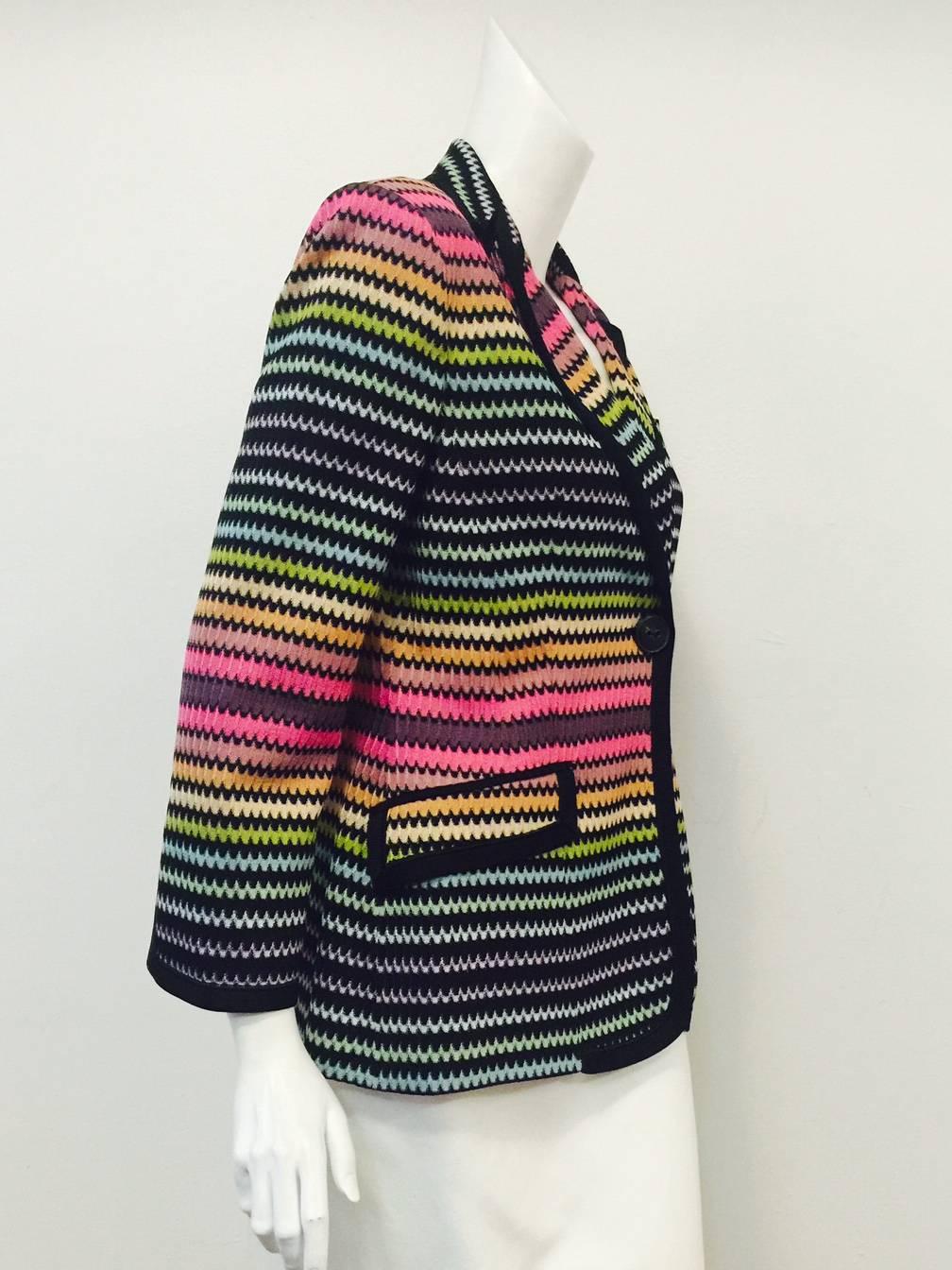 Missoni Multi-Colored Blazer is truly magnificent!  Features signature zig zag pattern knit, peaked lapels, flap pockets, and breast pocket.  Slit cuffs, solid black trim, single button closure and rear vent complete the look.  Fully lined in black