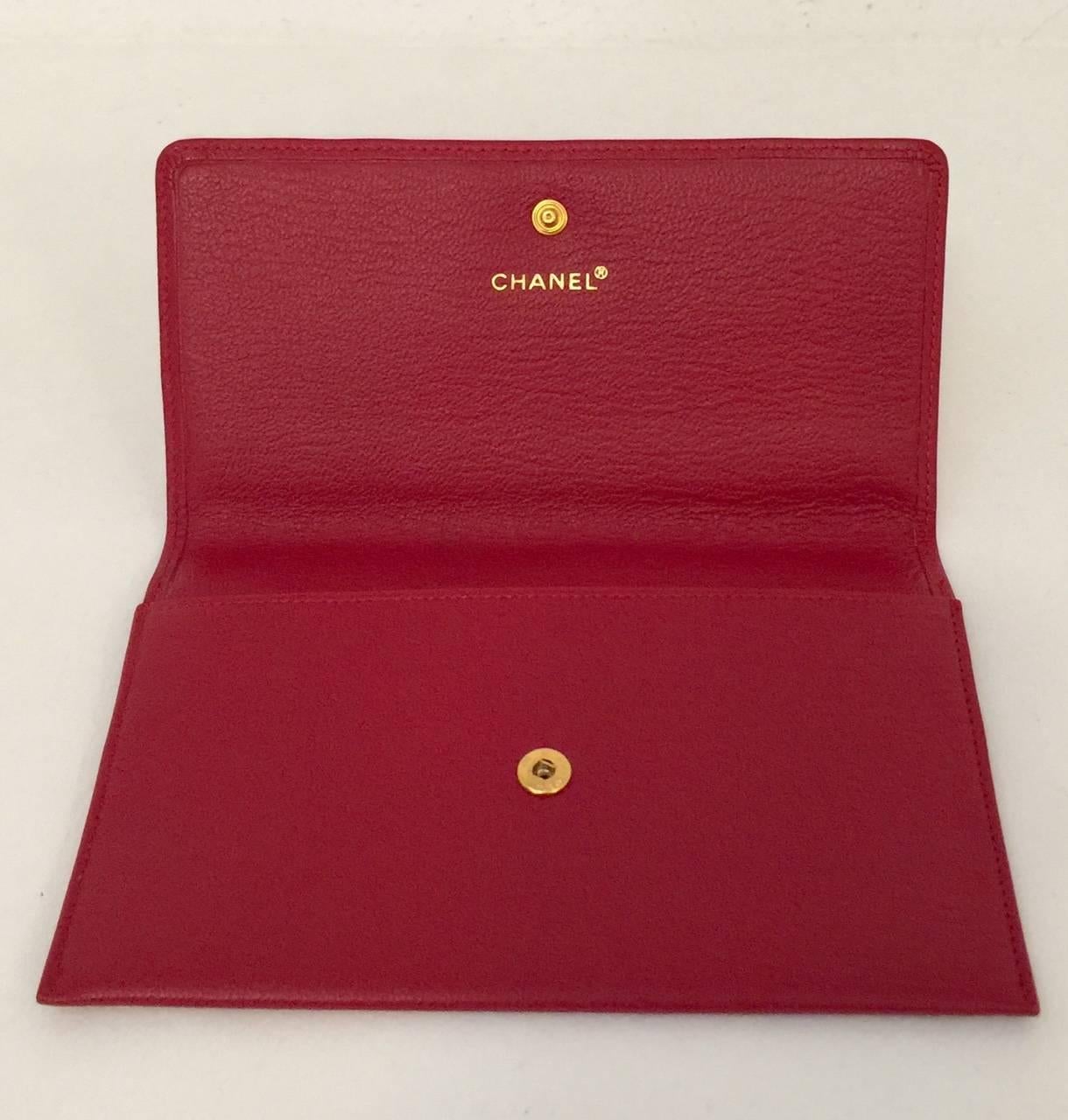 Deep Red Leather Pochette proves that Chanel is so much more than diamond-quilted bags and accessories!  Features supple leather in signature deep red and snap closure with renowned double 