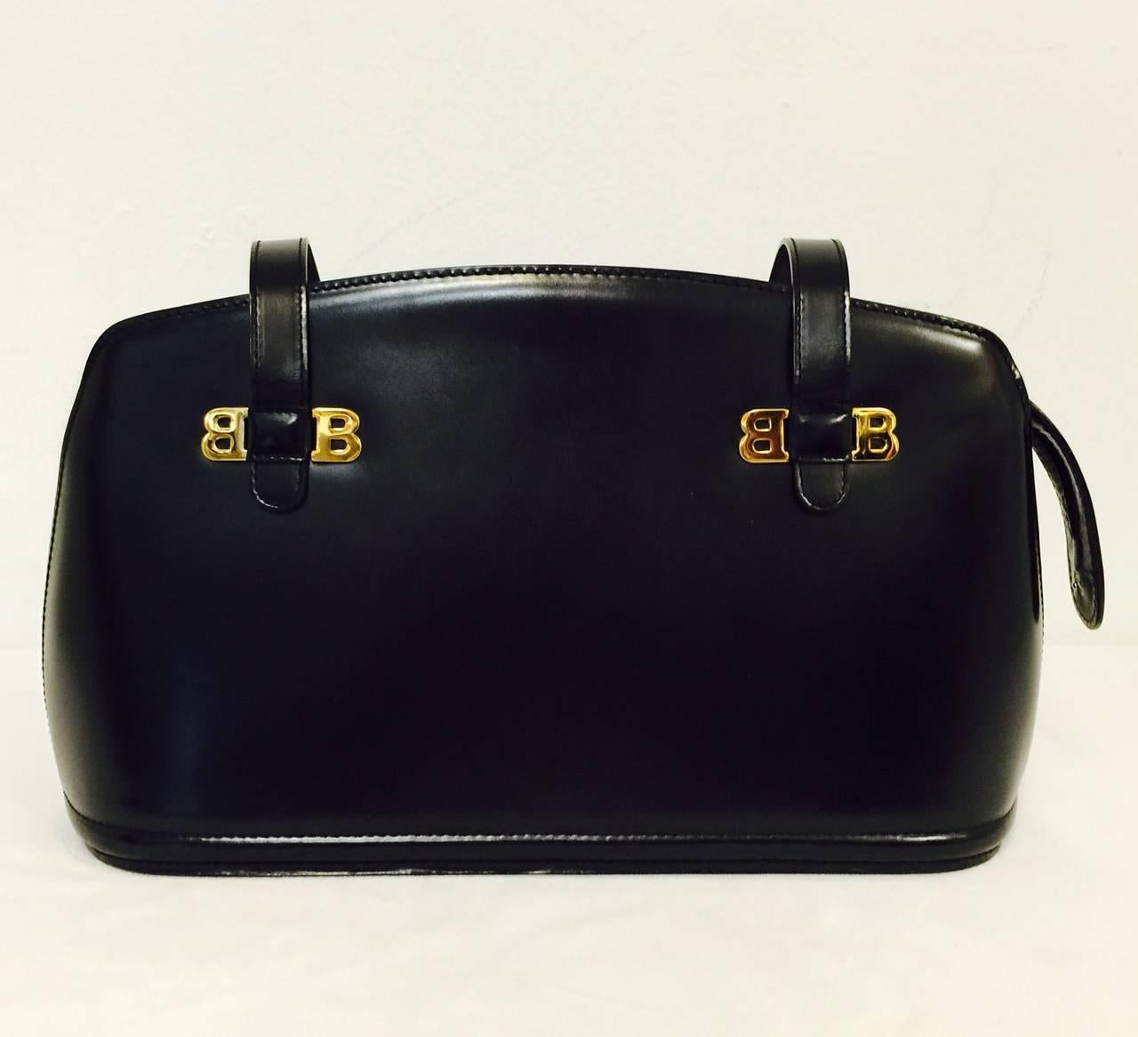Classic elegance at its best!  Bally Black Leather structured shoulder bag speaks volumes in several languages!  Recognized worldwide for superior leather goods and and other products, Bally is quietly sophisticated and an investment in