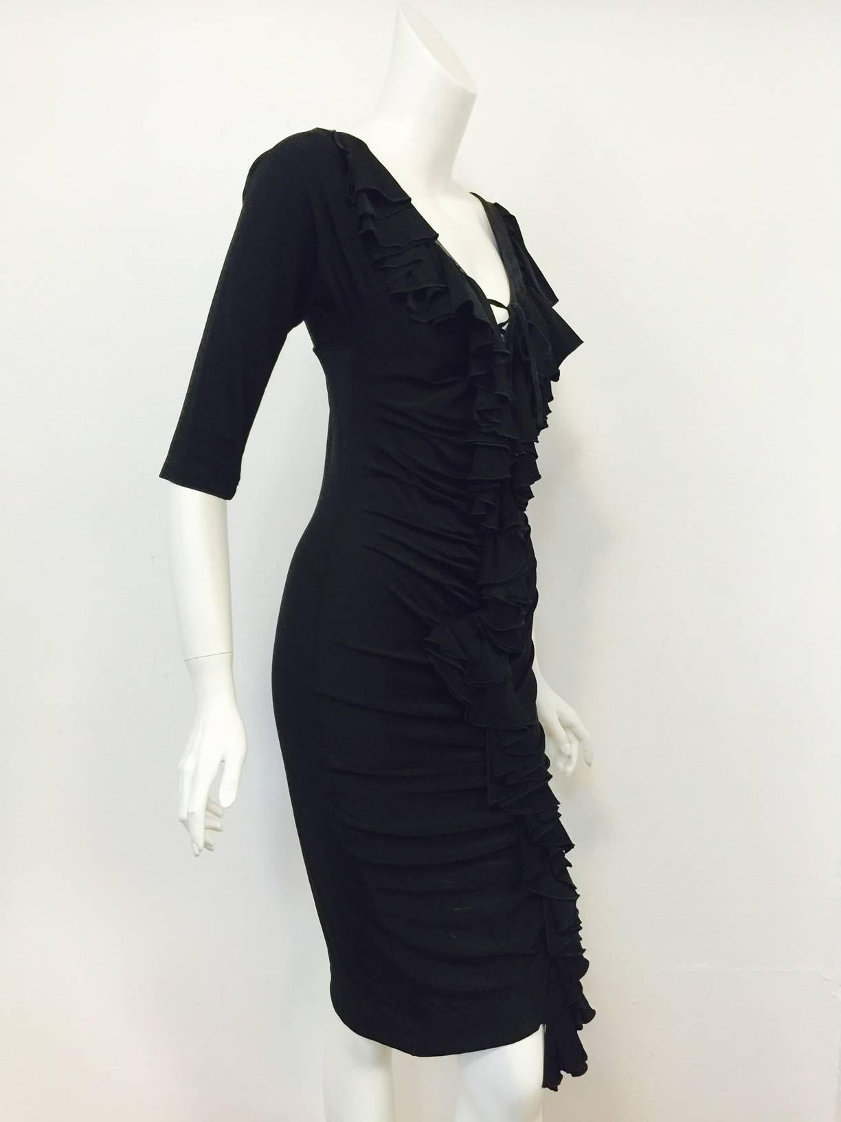 Black Viscose Ruched Sheath Dress is typically Roberto Cavalli! Body conscious? Of course! Knee-length design features luxurious black stretch fabric, elbow length dolman sleeves and ruched front from V-neckline to hem.  Over the top?  Not quite