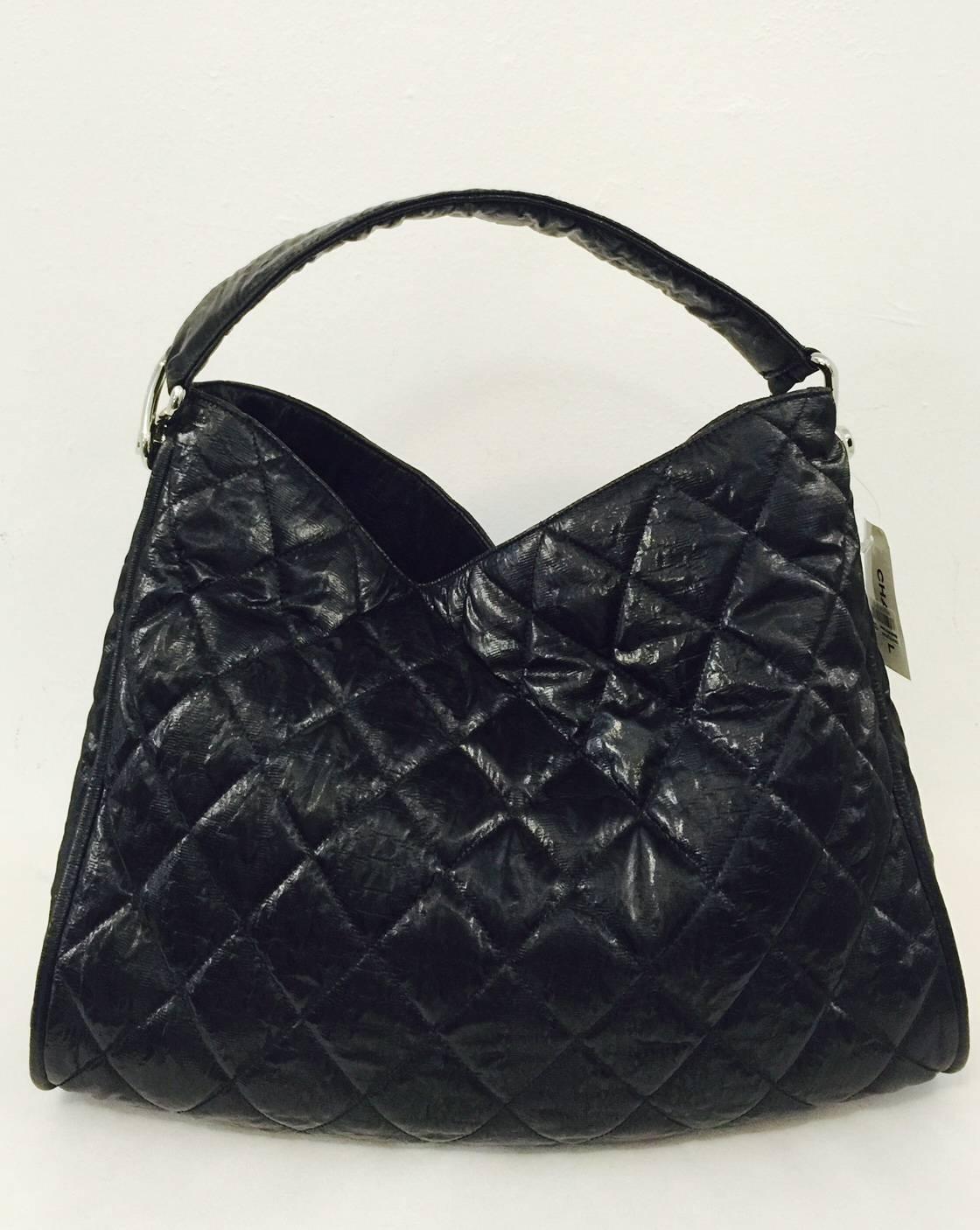 Crafted 2008 - 2009, Chanel Black Quilted Coated Canvas Le Marais Large Hobo Bag has become highly desired and is sought by all who are 