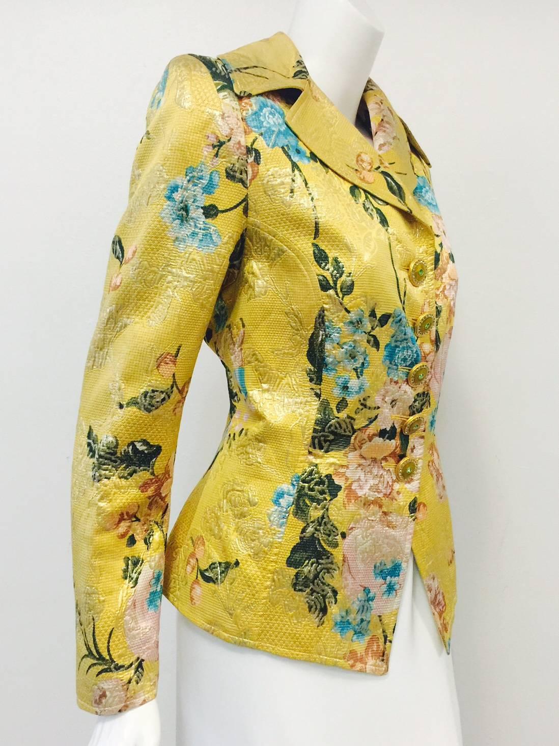 This Gold Metallic Brocade Fitted Jacket shows why Christian Lacroix was one of the most celebrated haute couturier's of the 20th Century!  Features exquisite fabric and mauve, turquoise, peach and forest green floral print.  Nipped waist and