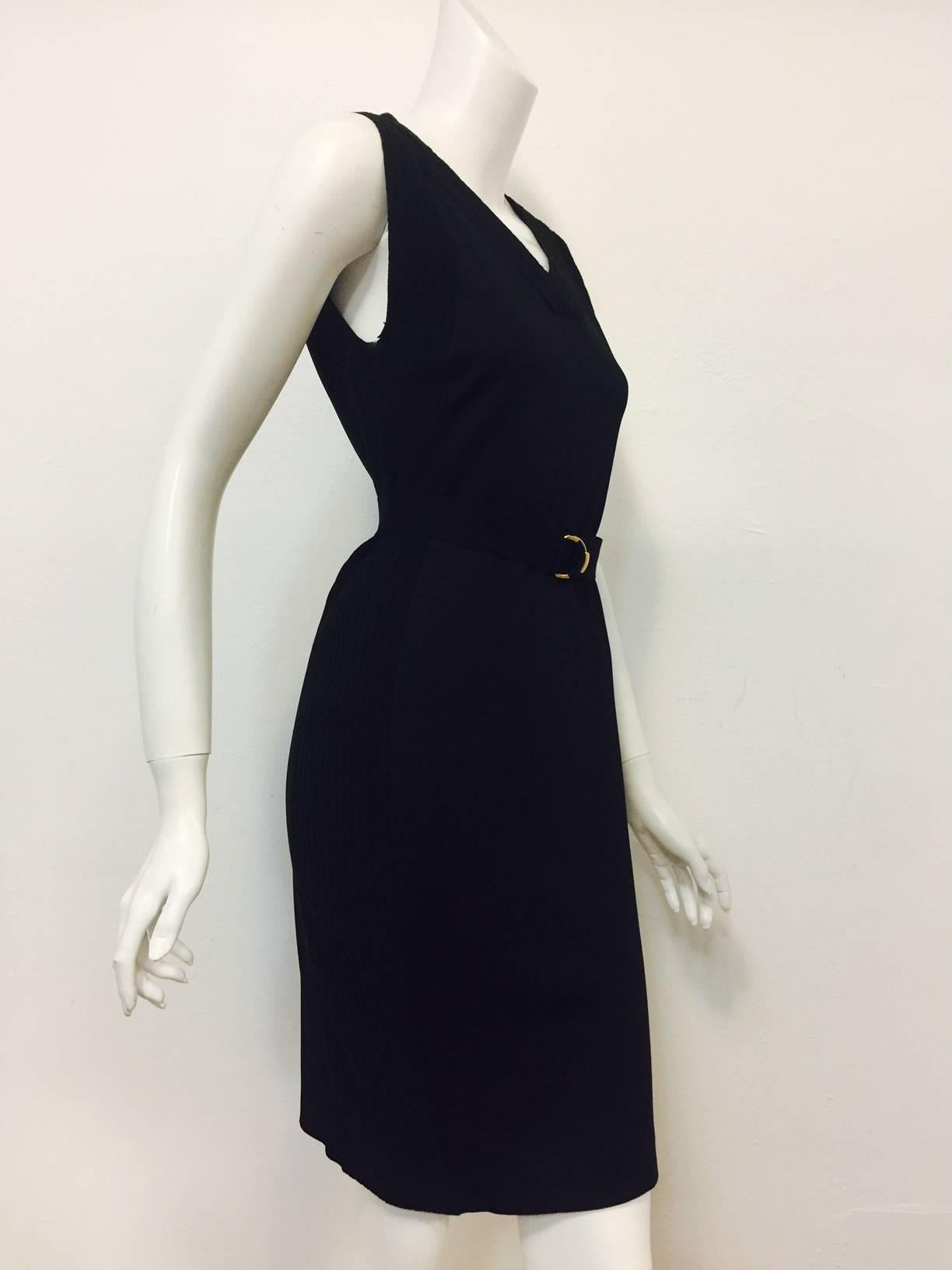 It's not secret that Gucci is glorious again!  This Black Viscose and Wool Blend Sheath is perfect for transitioning into fall and works equally well in Milan, Paris, New York and London!  Sleeveless dress features travel-friendly viscose blend body