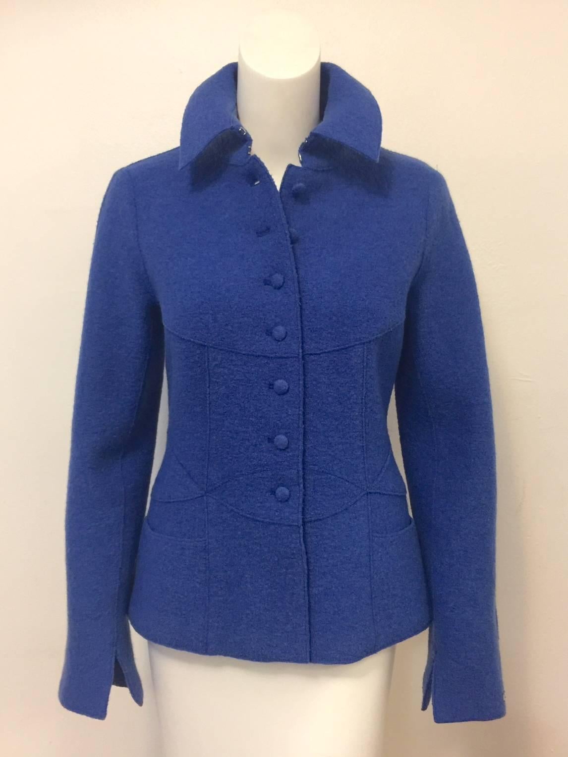 Chanel Fall 1999 Boiled Wool Fitted Jacket proves that Karl Lagerfeld can do more than recreate the world-famous tweed jacket season after season!  Features luxurious fabric and a more fitted silhouette than is typical of a Chanel jacket.  