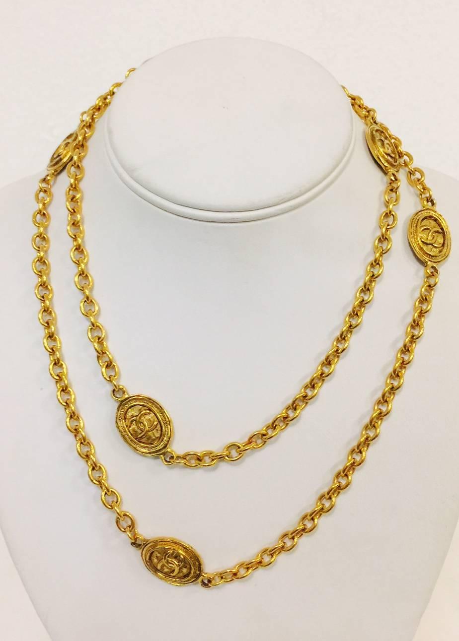 A must for every collector of Coco!  This classic gold tone necklace features open link chain and five oval stations featuring the iconic CC logo.  Front and backs of stations are identical.  No worries if it moves around!  Fabricated between