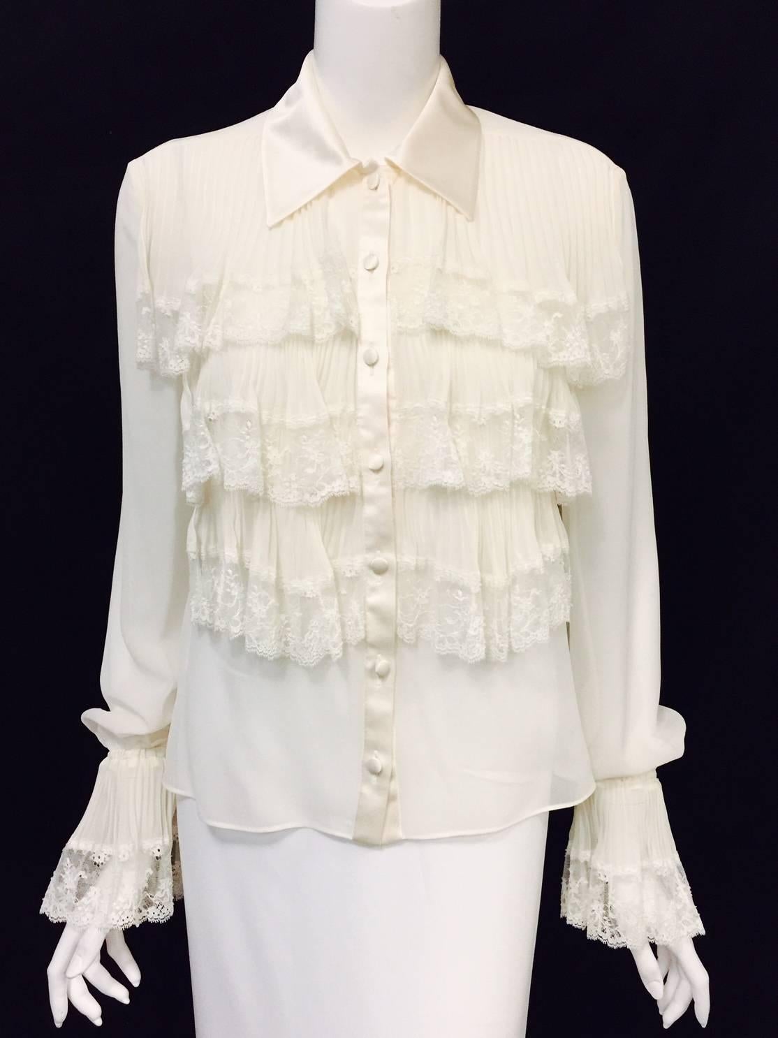 Oh so Valentino Ivory Silk Blouse illustrates why this Italian master is considered one of the most influential couturiers of the 20th Century!  Features ultra-luxurious sheer fabric, spread silk satin collar, and 7 covered-buttons on front.  The