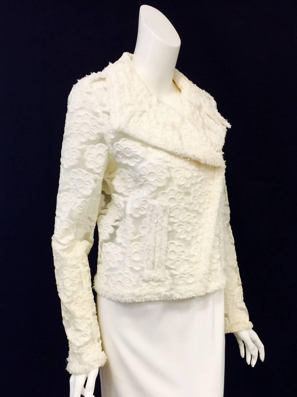 2009 Cruise Chanel Ivory Polyurethane Biker Jacket is worthy of Coco herself!  Inspired by Marlon Brando's unforgettable presence on the Silver Screen, this jacket is contemporary, chic, and sophisticated. Features technologically advanced sheer
