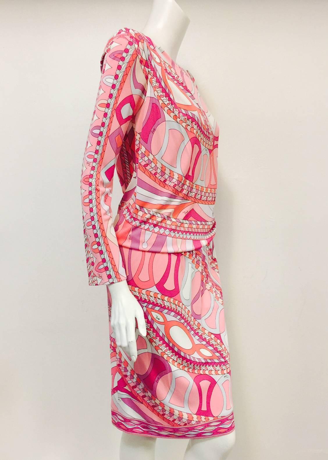 Print Sheath Dress With Long Sleeves is quintessentially Emilio Pucci! Abstract fuschia, mauve, black and white pepper print highlights a form-fitting, flattering design. Reminiscent of the 1920s, dress is draped and gathered at the waist and left