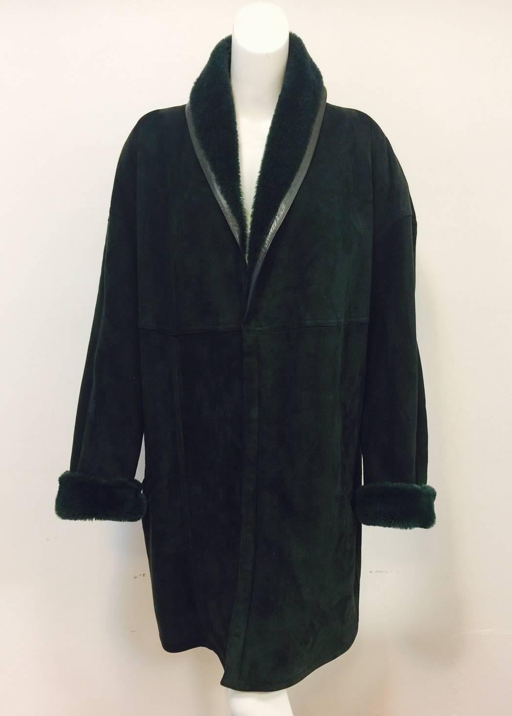 This Gianni Versace Coat is a must for any connoisseur of this legendary designer's menswear!  Features ultra-luxurious, weighty deep forest green shearling, generous shawl collar and 5-snap closure.  Slightly padded round shoulders.  Two pockets