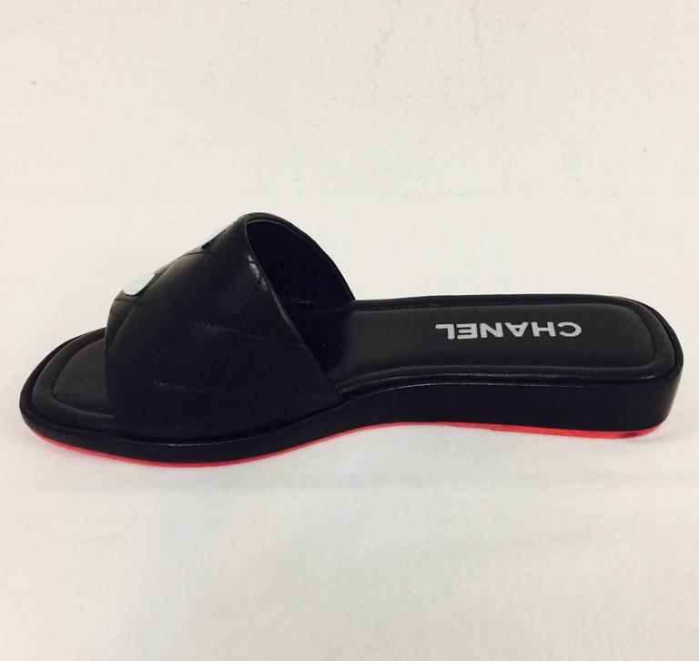 chanel black quilted slides
