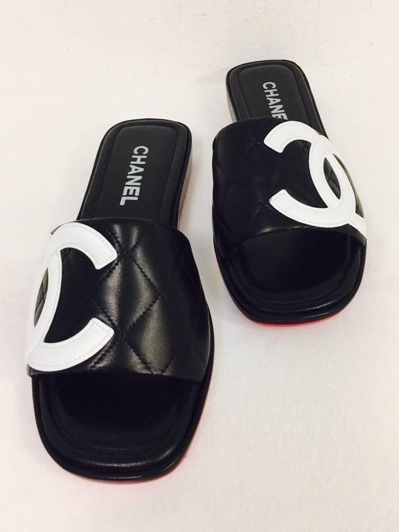 chanel black quilted slides