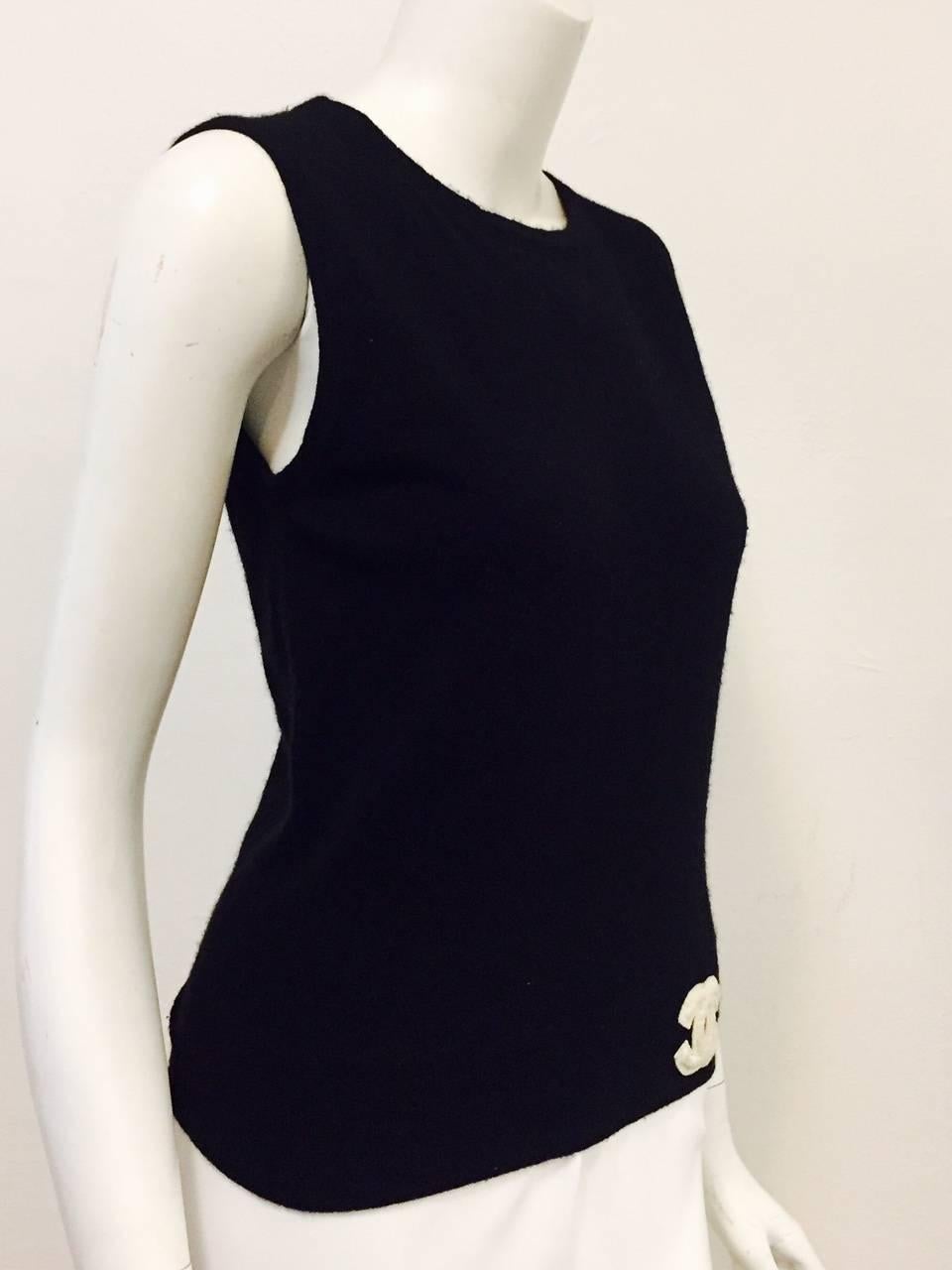 Chanel is much more than feminine skirt suits and quilted handbags!  Reminiscent of collegiate Varsity squads, this black sweater vest is a must for any connoisseur of Coco.  Features ultra-luxurious cashmere, round neckline nad deep banded hem. 