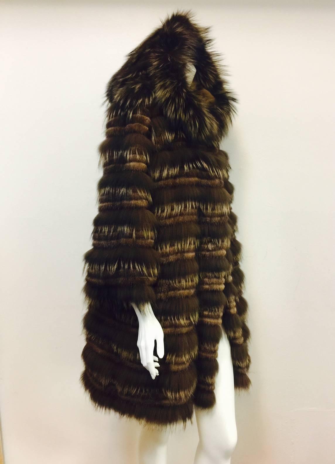 Carmen Marc Valvo is much more than the creator of fabulous Red Carpet creations!  This Brown Mink and Feathered Fox Corduroy Coat features ultra-luxurious fur sourced from Denmark and Finland.  Worth of Saga Furs status, this coat was purchased