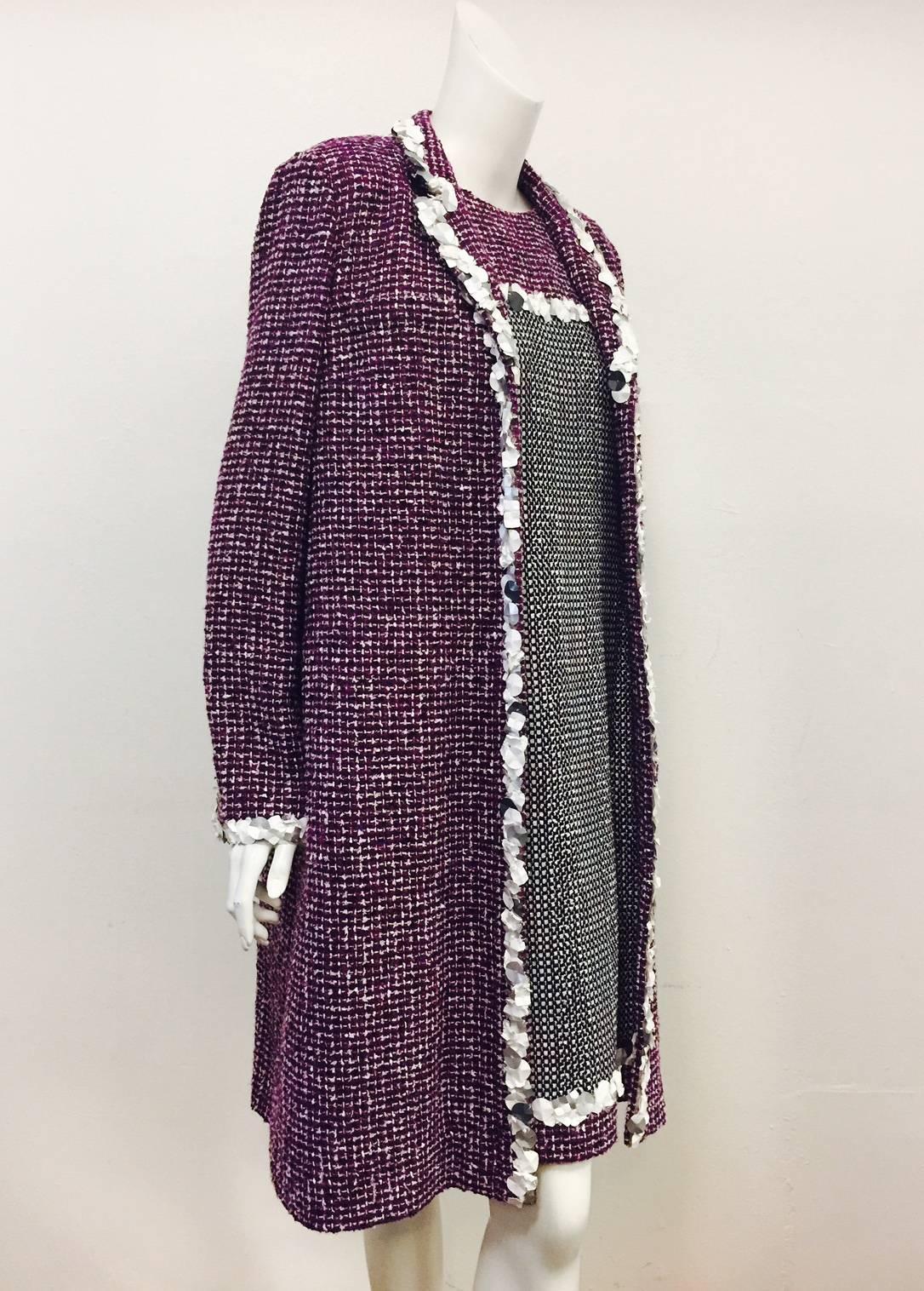 Chanel Multi Color Purple Tweed Sleeveless Dress was simply not enough!  It needed a long coat that perfectly complements the timeless style and sophistication of Chanel.  Influenced by the design aesthetic of the 1960's, this ensemble continues to