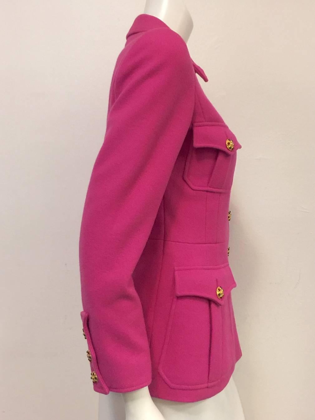 Chanel Boutique 1996 Fall Fuchsia Wool Jacket is a case study in Karl's innate ability to retool Coco's iconic jacket time and again!  Features ultra-luxurious Melton wool, and sophisticated design and styling that evokes the military.  Fitted