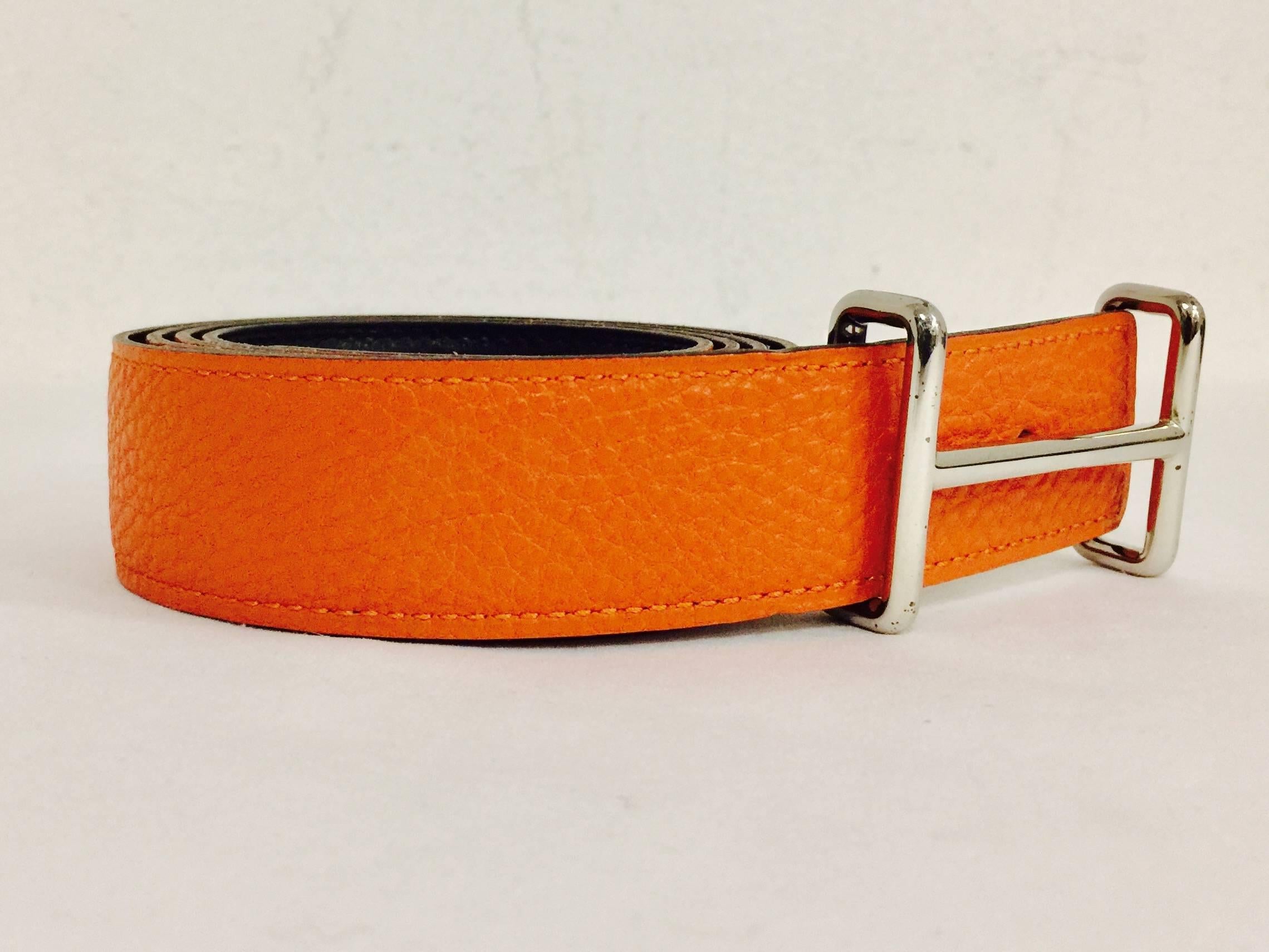 2004 Hermes Reversible Orange Togo and Black Chamonix Belt is perfect for a man or a woman!  Features signature orange and black combination with Palladium Idem buckle.  Stamped H in a Square.  Made in France.  Fits Waists 38