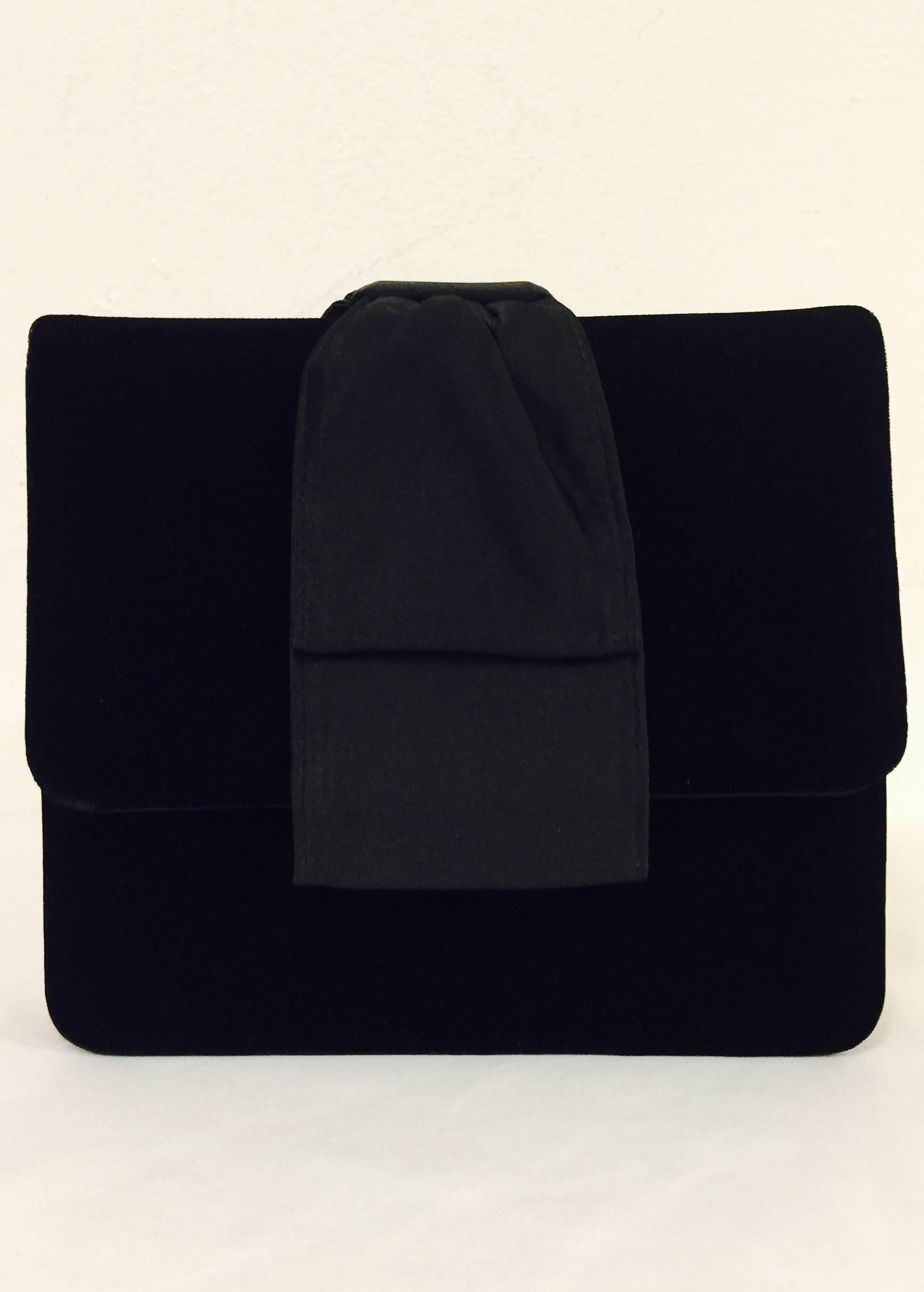 Paloma Picasso is so much more than her collaboration with Tiffany & Co.!  Black Velvet Convertible Evening bag is an ageless and timeless classic envelope clutch.  Features single gusset design, flap front, snap closure and ravishing red satin