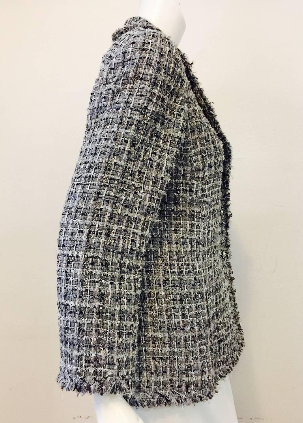 Chanel Pink and Slate Multi Color Jacket is classic Coco!   Features signature tweed fabric,  two on-seam pockets, and double vented back.  Finished with 3 buttons front closure and two buttons on either side of vent.  Look closely,