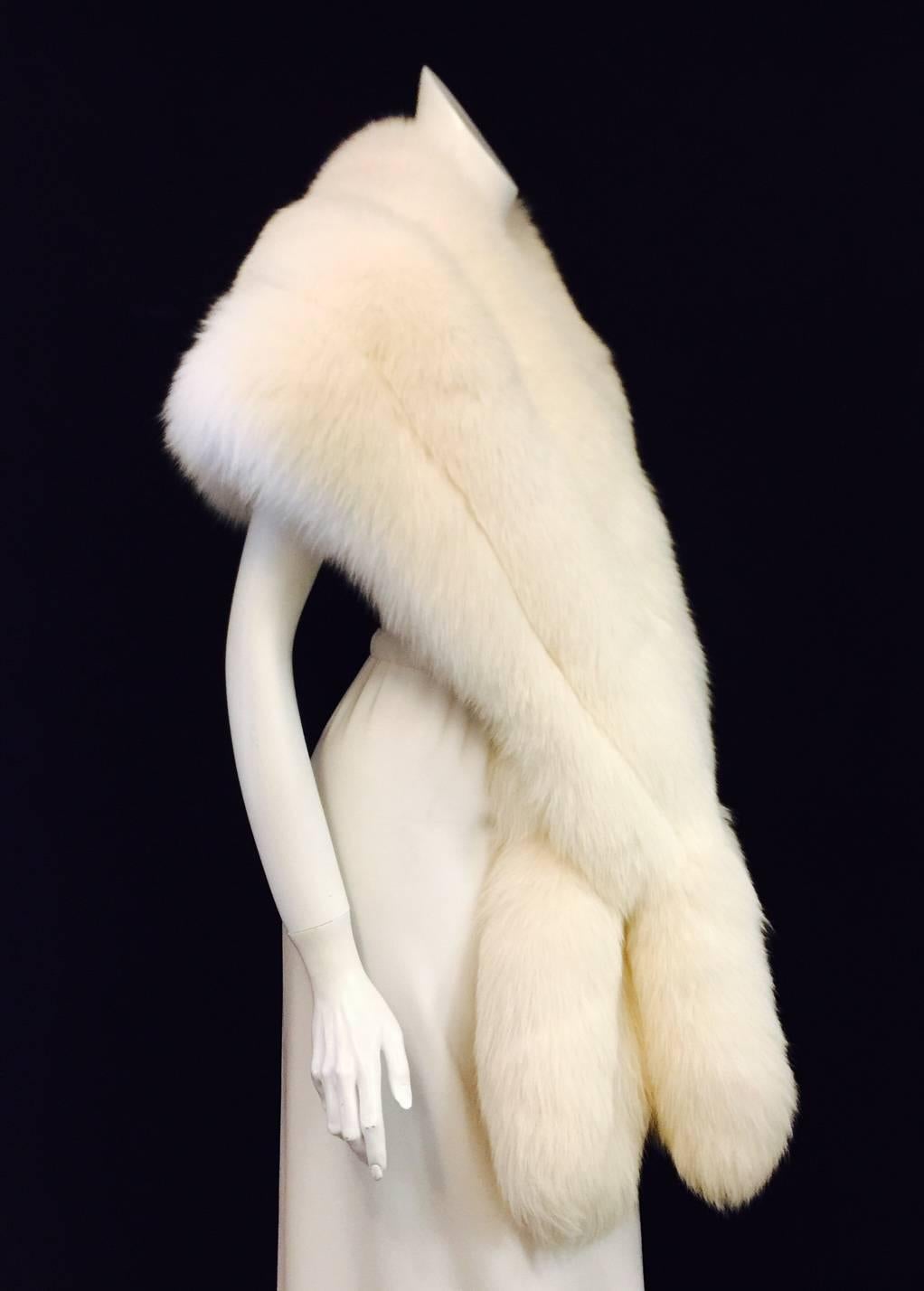 Nothing quite finishes an evening look like fur.  Exuberant White Fox stole evokes Hollywood's Golden Age and the stars of the early Talkies.  Worthy of Garbo, Dietrich, or even Myrna Loy, stole features exquisite pelts of fox and well-crafted,