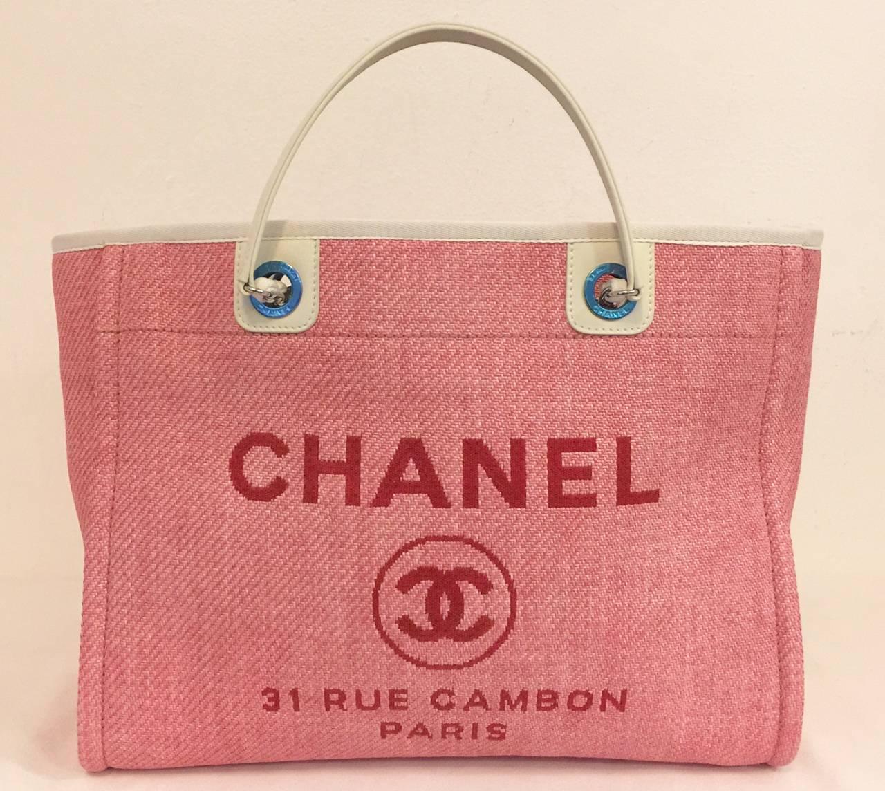 Introduced in 2012 as part of the Deauville Ligne Collection, this Chanel Pink Tote  has become highly coveted by connoisseurs of all things Coco!  Features the address of Mademoiselle's Cambon boutique, as well as the iconic double "C"