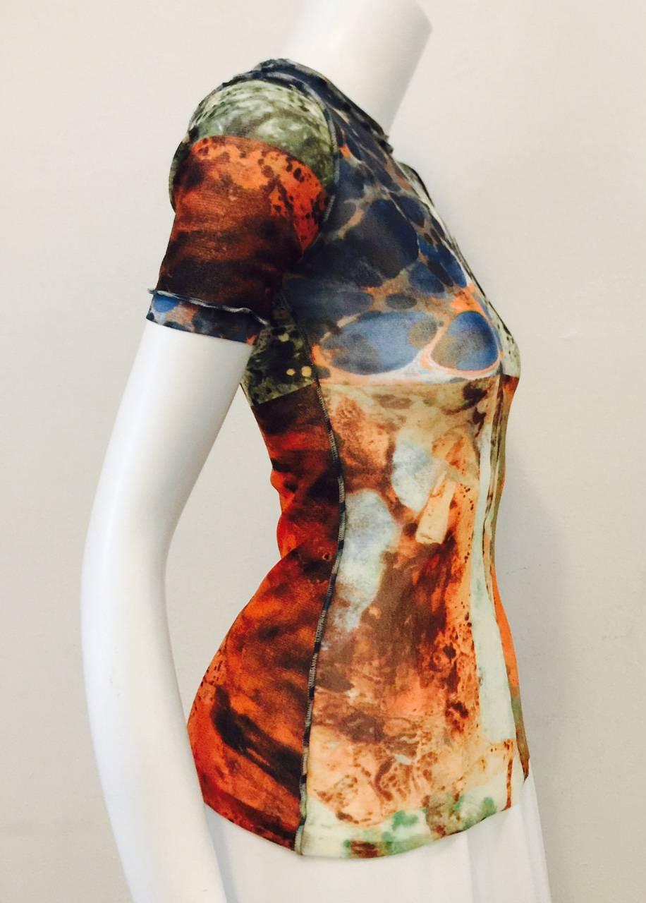 Stretch Short Sleeve Top is a must for any connoisseur of Late 20th Century fashion!  Features undeniably Jean Paul Gaultier abstract pattern in warm Earth tones perfect for year-round wear.  Exposed seams finish this 