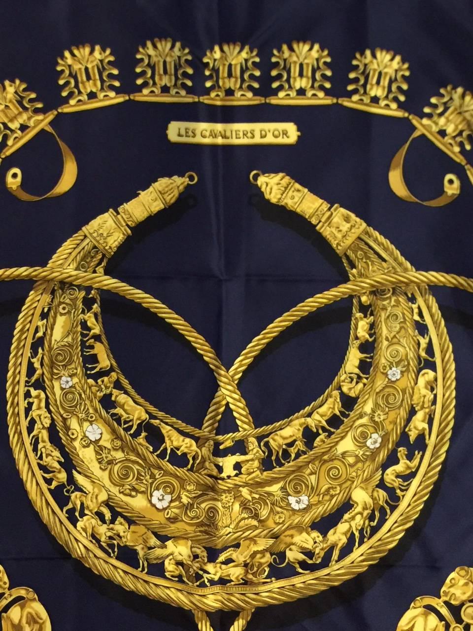 Les Cavaliers D'Or, designed by Vladimir Rybaltchenko, has become highly desired by connoisseurs of fine silk scarves.  This magnificent design by one of Hermes' most beloved artists, depicts a solid gold Scythian pectoral breastplate (circa 4th