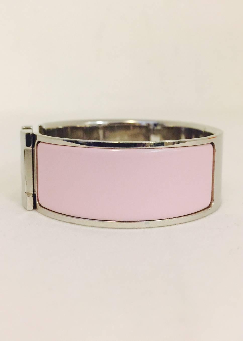 Hermes Palladium Pink Enamel Clic Clac H Bracelet  is one of the most highly recognizable pieces from this legendary luxury goods house! Features the world-renowned 