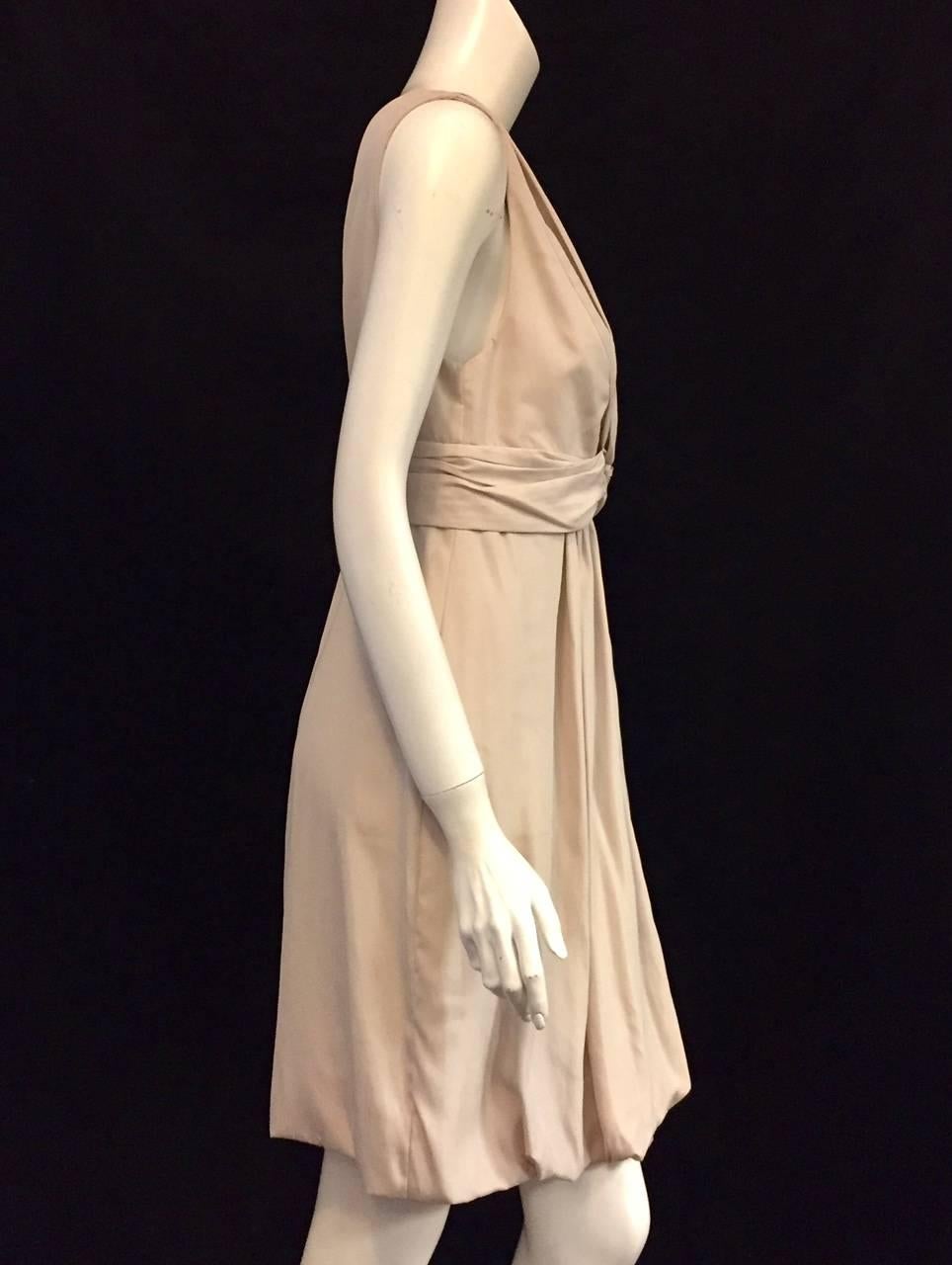 Stella McCartney has become one of the most highly desired designers among celebrities and socialites alike.  Exquisitely Gathered Beige Silk Blend Sleeveless Dress features high waist, plunging 