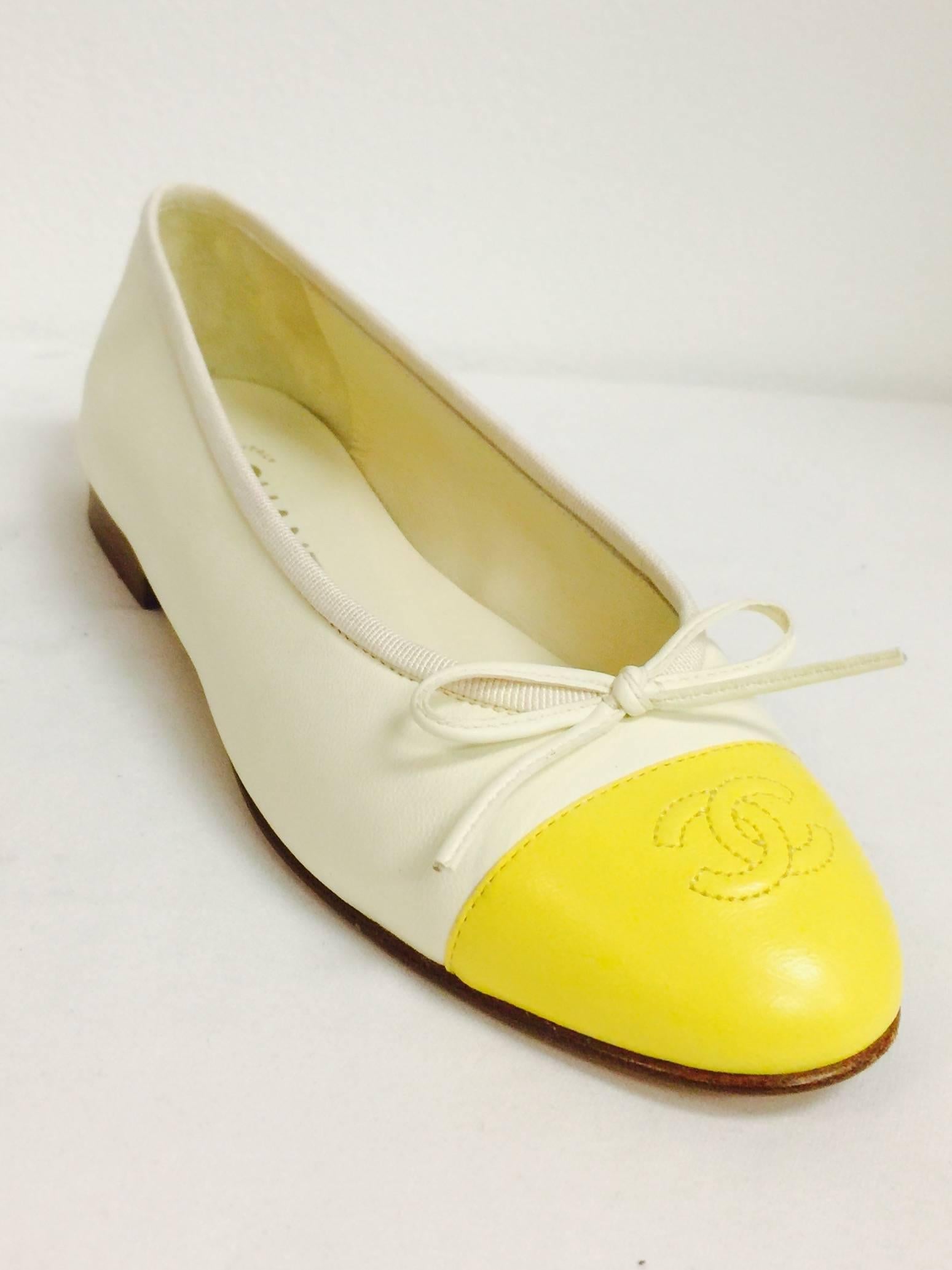 Walk on sunshine in these classic Vanilla Leather Ballerina Flats With Lemon Cap Toes. Features include leather soles and insoles, double "C" stitched smooth leather cap toes and feminine leather bow on the vamps. Finished with grosgrain
