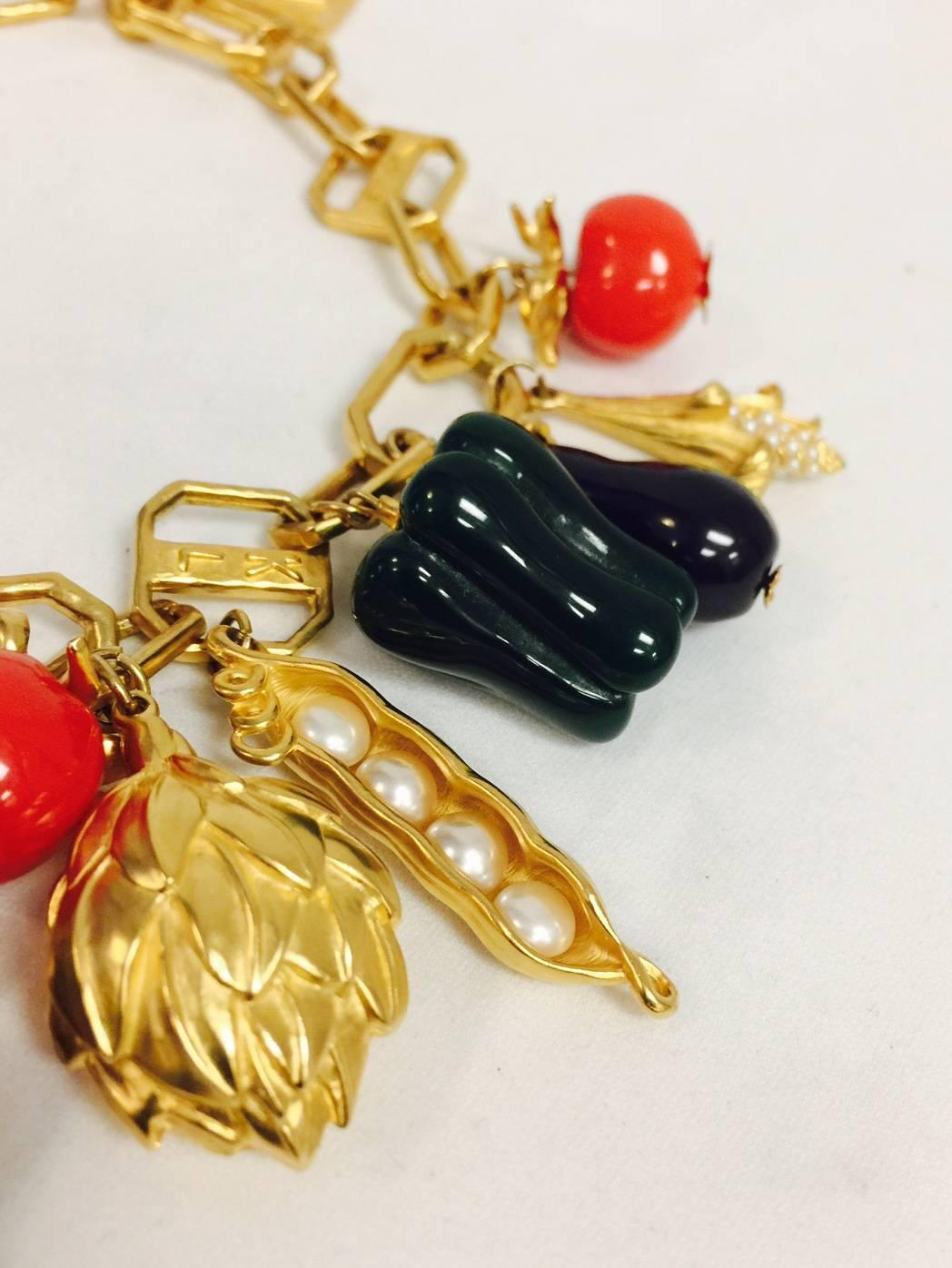 Impossible to find!  Karl dug up a fabulous, whimsical design with this beauty!  Fashioned in gold tone you will delight in green peppers, cherry tomatoes, beets, eggplants detailed to perfection in resin.  Gold tone peas and ears of corn are