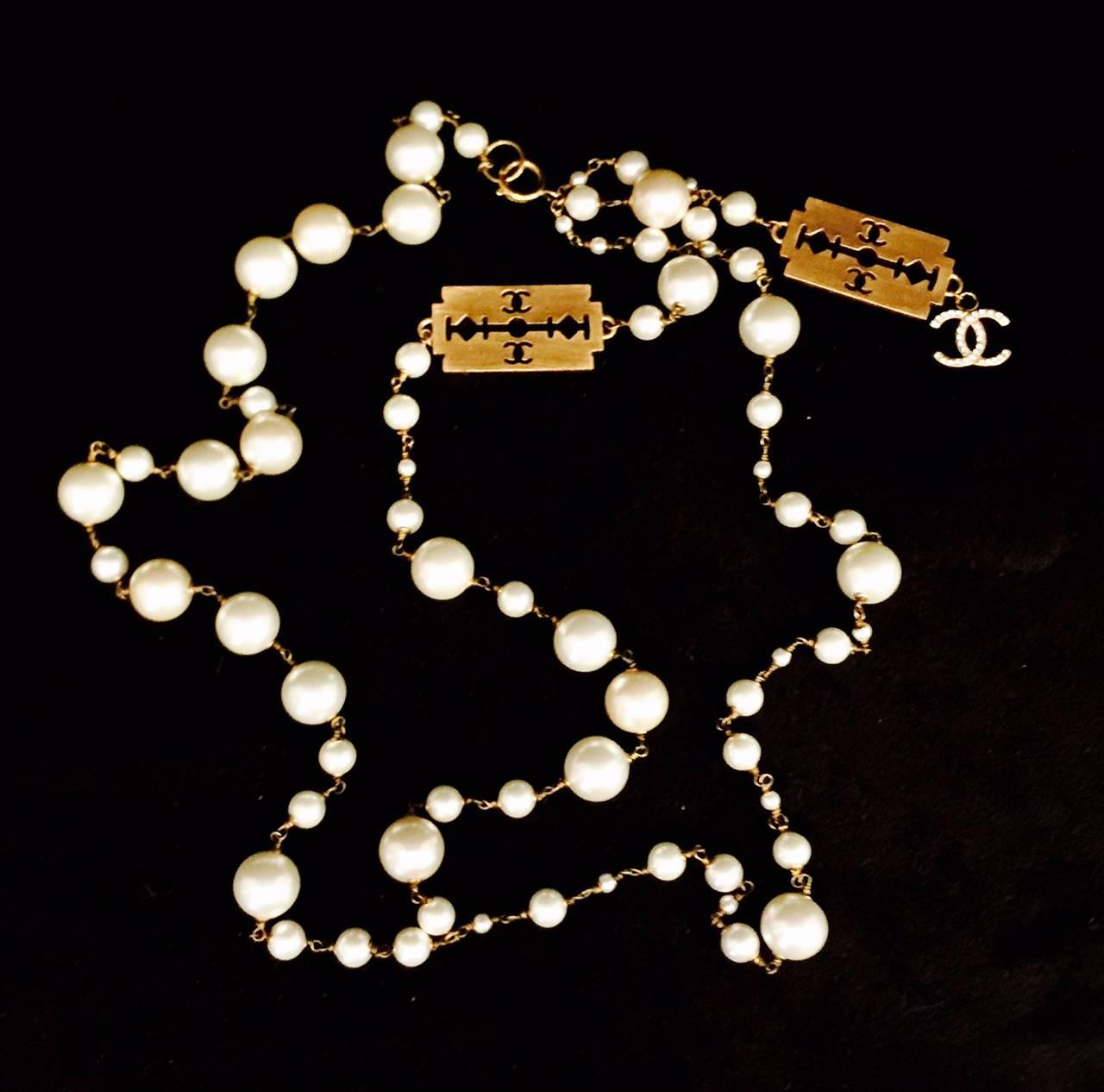 For Coco collectors world wide!  This impossible to find Razor Necklace is definitely a bit edgy!  Faux pearls range in size: 4mm, 8.5mm and 14mm, on gold tone chain.  One side is a double strand.  Opposite side is a single strand.  There are two