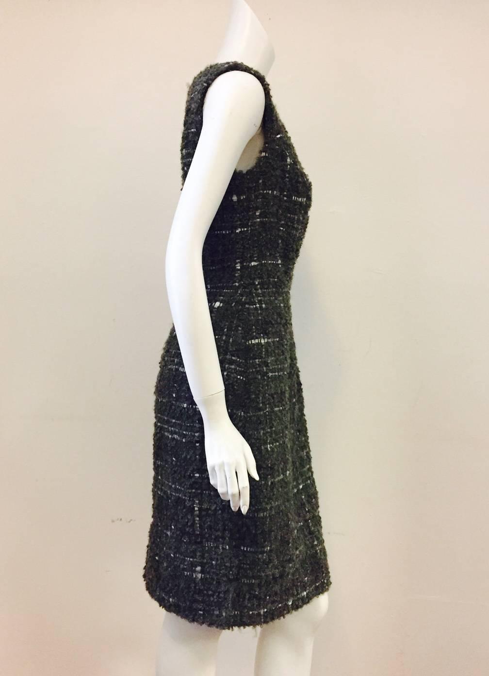 Christian Dior Aubergine, Olive, and White Boucle Wool Blend Tweed Dress is a must for any classically collected woman!  Features ultra-luxurious, substantial fabric, sleeveless design, bateau neckline, and sublime sheath silhouette.  Rear slit. 