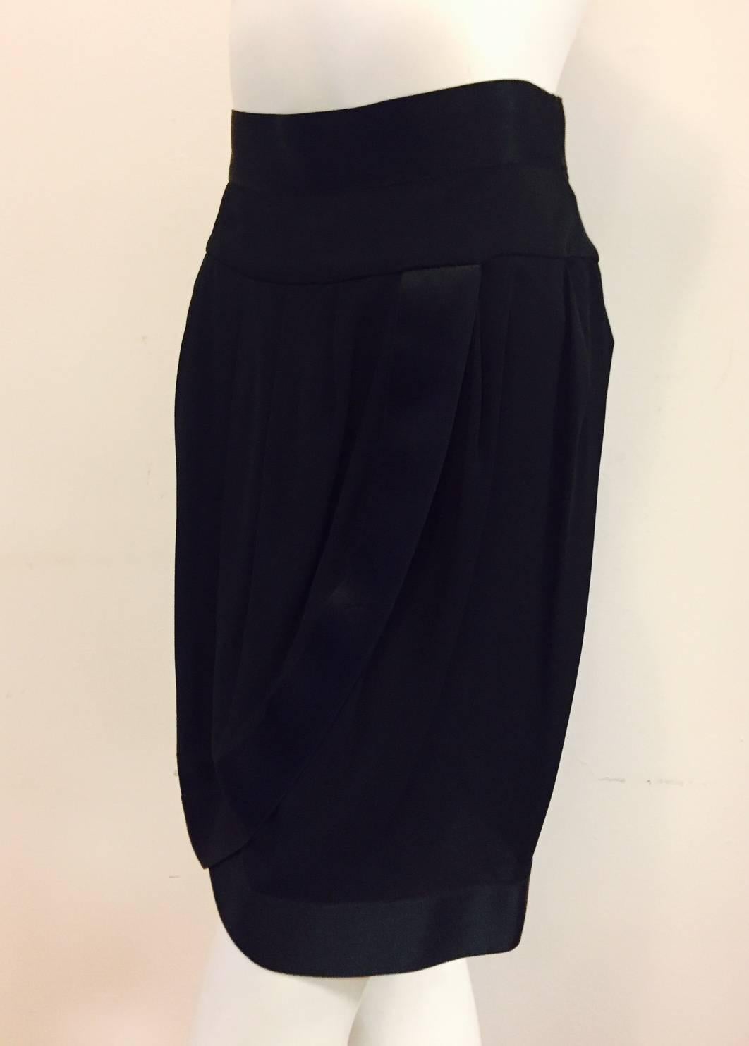 This Chanel Black Evening Skirt is Inspired by sarongs that have been popular since literally the beginning of time!  Features ultra-luxurious 100% silk and extra-wide silk satin banded hem.  Pleated waistline is supported by wide silk and silk