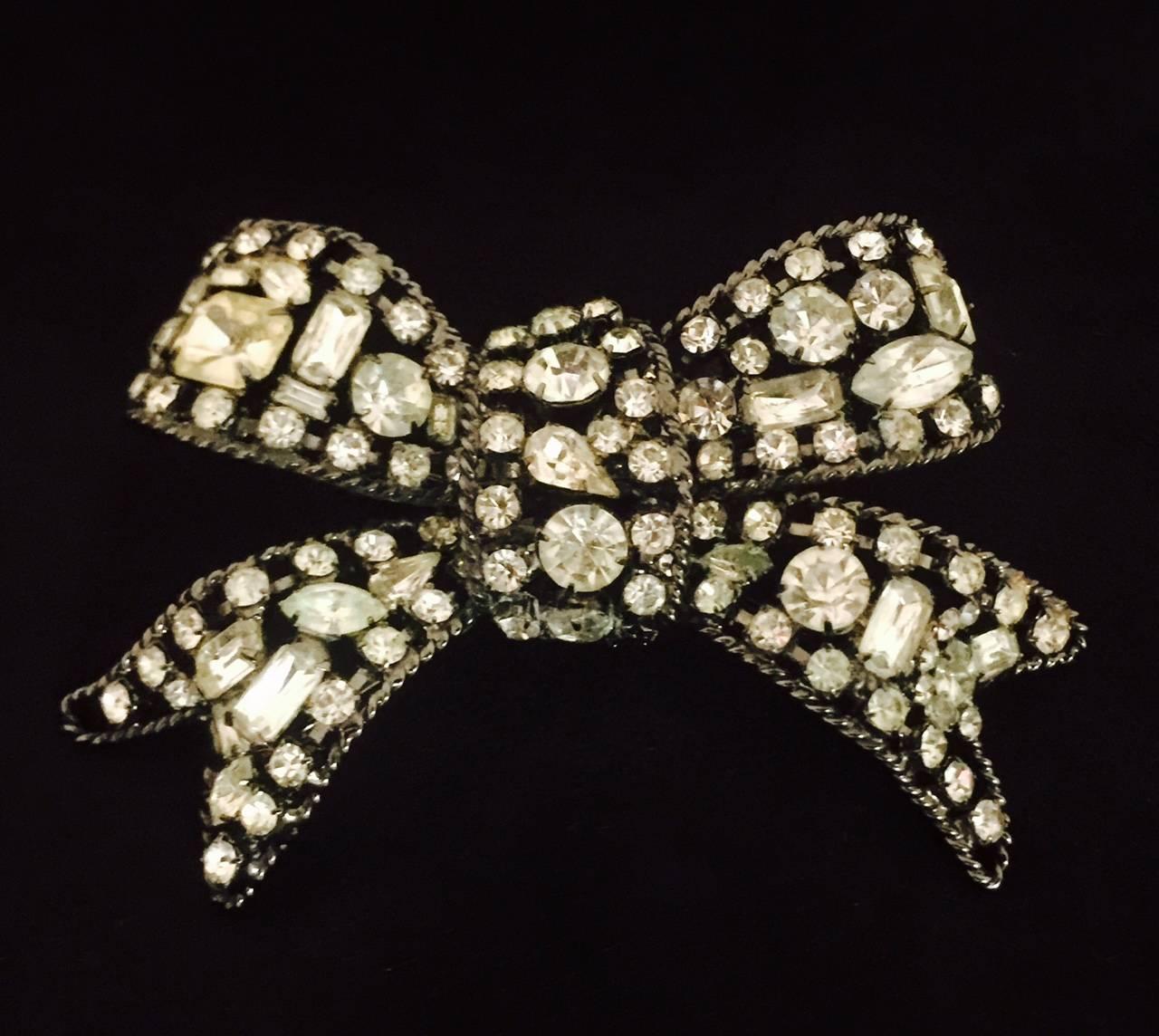 Lawrence VRBA, a former top jewelry designer for Miriam Haskell in the 1960s, creates amazing costume jewelry. This is the gift you never undo!  Fabricated in blackened metal this bow is, simply stated, a fabulous brooch! Curvy, sensual and