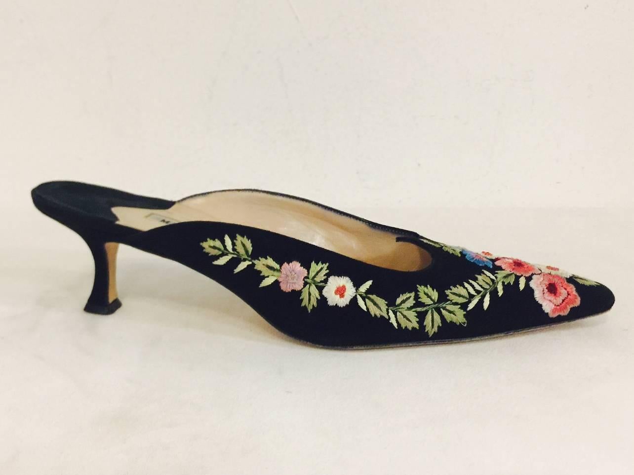 Evoking the grand palaces of the Ottoman Empire, these Manolo Blahnik Black Suede Mules are an investment in international style!  Features pointed toes, leather soles, insoles and lining.  The piece de resistance?  An unforgettable exotic floral