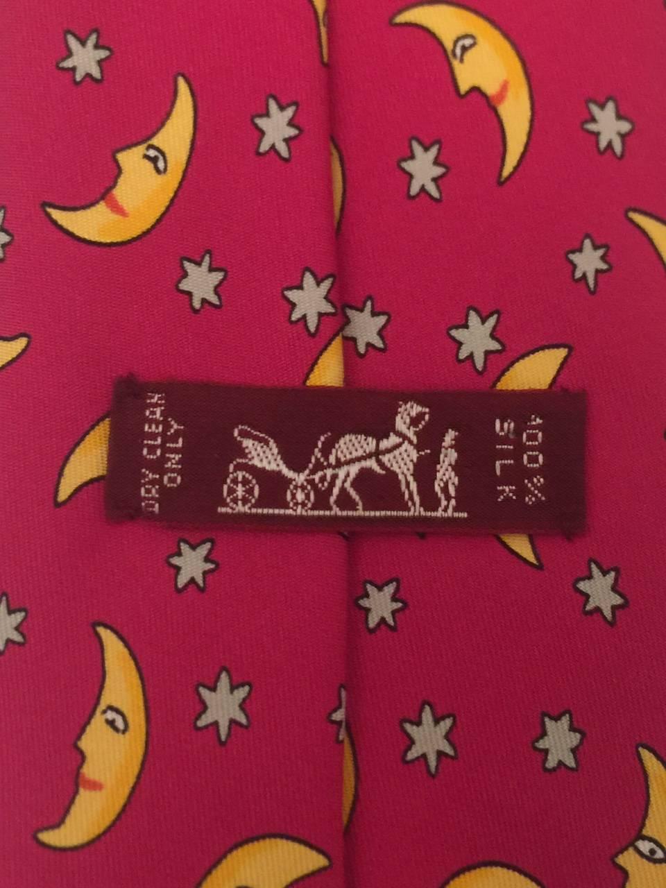 Hermes ties are world renown for quality and often whimsical designs.  This  cerise pink and vibrant yellow cravat is not exception!  This vintage Hermes tie is a must for any Hermes collector or a whimsical tie aficionado.  Excellent Condition.  