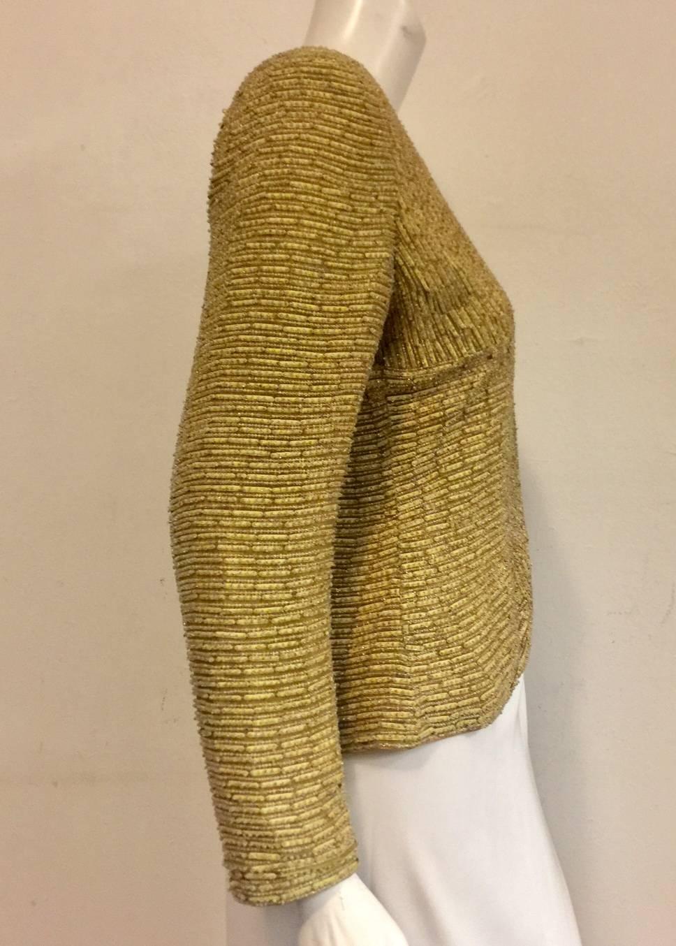 Magnificent Mary McFadden Vintage Couture Jacket adds value to any woman's wardrobe!  This beige/mustard jacket features classic tailoring, exquisite embroidery, and beautiful beadwork allover.  It is impossible to put into words the amount of work