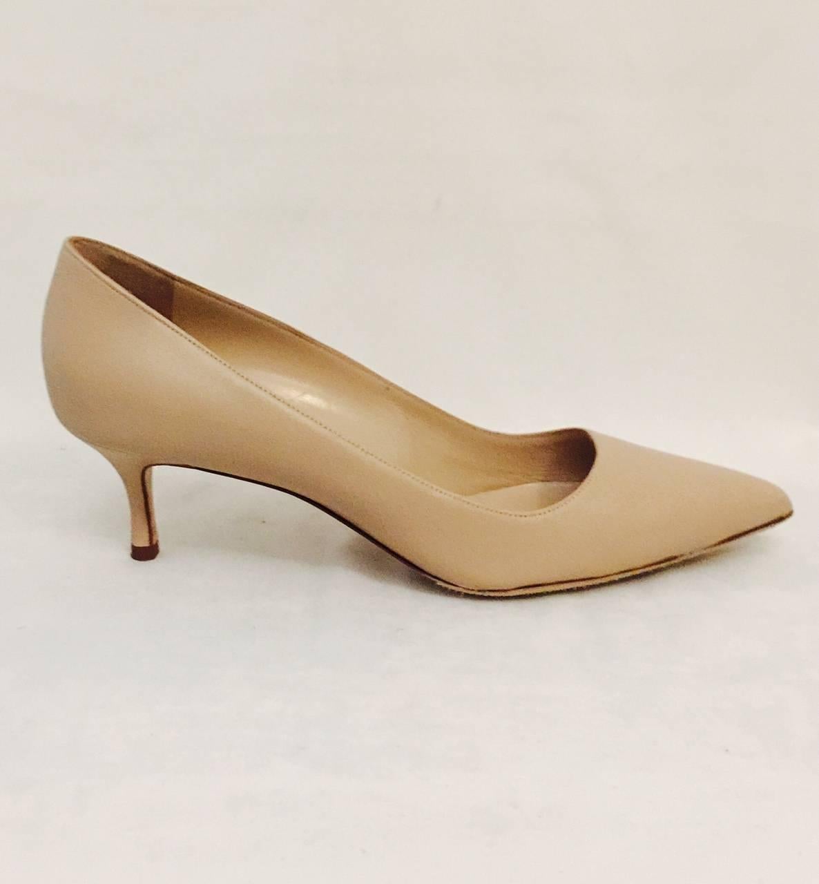 No wonder Manolo Blahnik became a household name and one of the most celebrated shoe designers of the last 20 years!  These Beige Leather Low Pumps are quintessentially neutral and feature feminine pointed toes.  A well established classic that