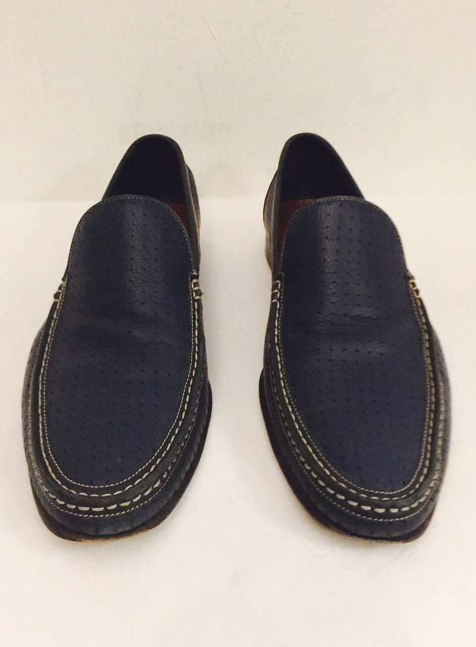 These handsome A. Testoni shoes are crafted in Italy from fine perforated leather, and finished with  hand stitched moccasin detail. In navy blue for comfortable wear with dress or casual clothes.