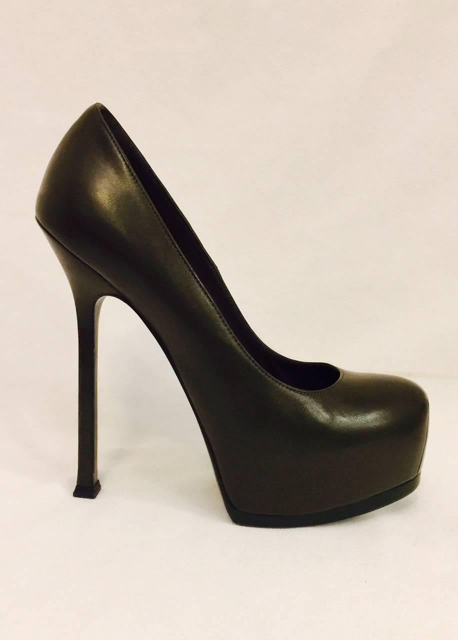 Yves Saint Laurent high heel pumps feature ultra-luxurious olive smooth leather all over and softly rounded toe.  Olive leather soles, insoles and lining. The piece de resistance? A generous 1.5