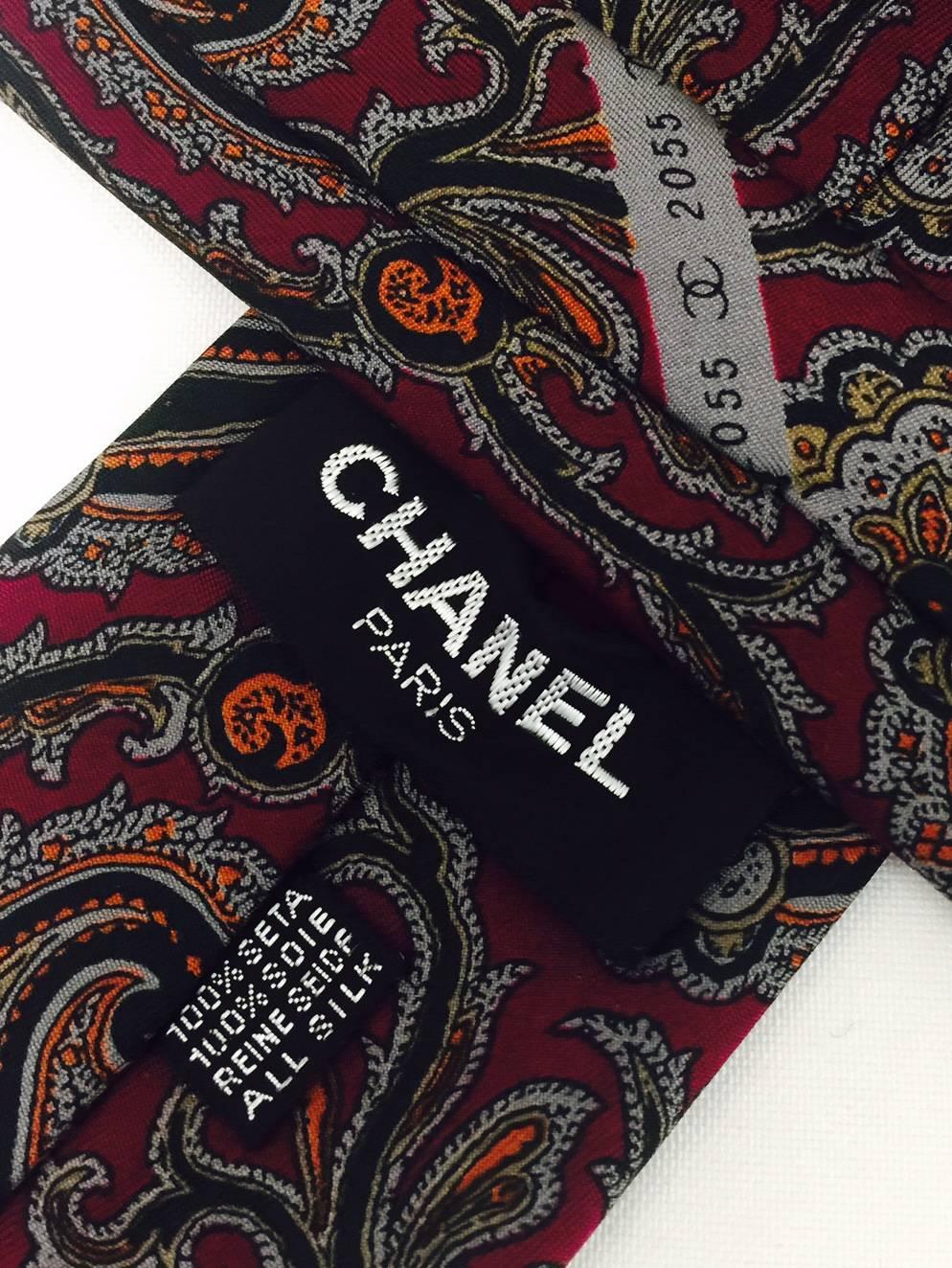 Champion Chanel signature design on this updated Paisley print throughout the tie.  Made of 100% silk with a deep burgundy background.  
Measurements:  Length - 57