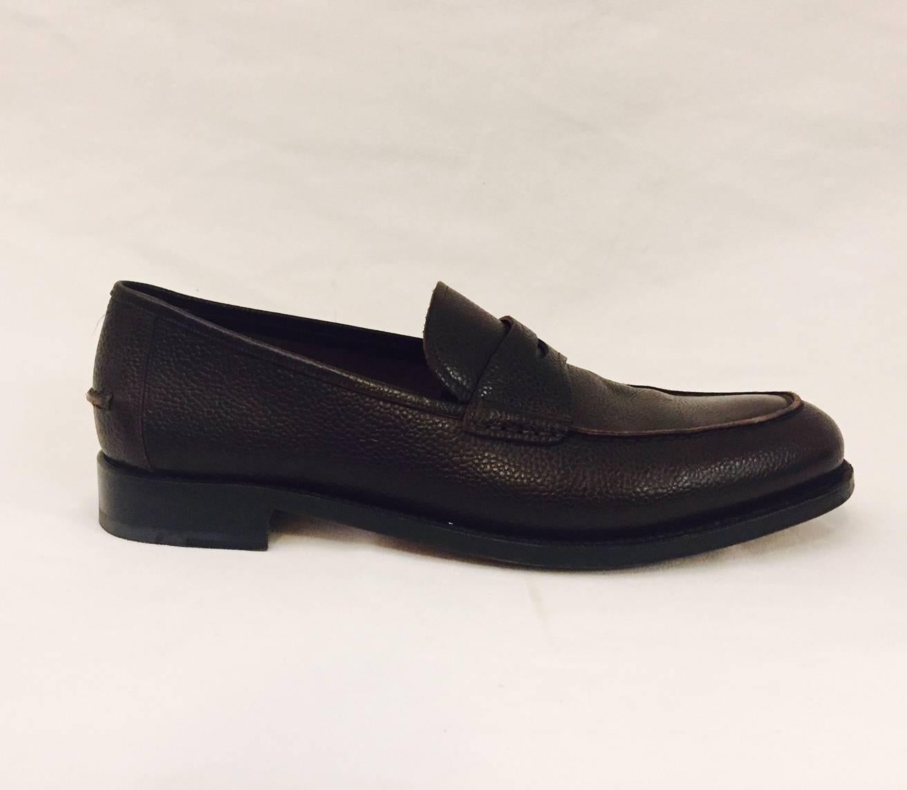 Classic penny loafer from the top of the line Tramezza collection.  Made by Italian craftsmen in traditional methods,  a rich cocoa colour in a pebble texture calf skin leather, slightly padded insole,  with leather sole, and a one inch heel.  Very