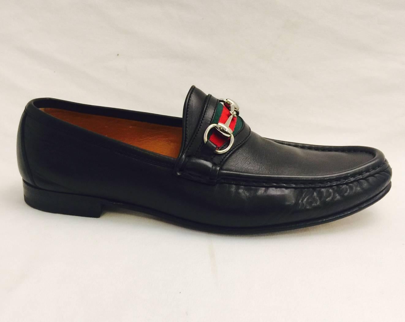 A pair of classic Gucci Penny loafers, with the iconic grossgrain ribbon in green and red, and the horsebit trim in silver tone.   Made in Italy of fine leather, size as marked 9 1/2 D.  Light wear on sole.