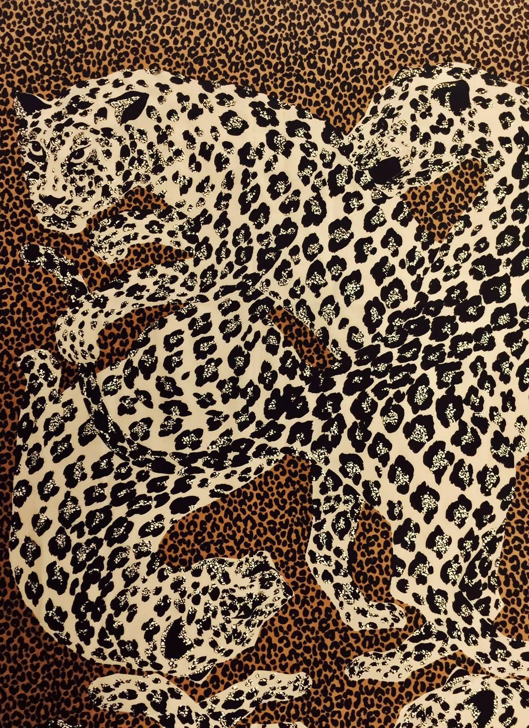 The world renowned house of Yves Saint Laurent impeccably created this foulard for those with discerning taste and a craving for animal prints.  This 12 leopard scarf/shawl is highly desired and crafted in Italy from 100% silk with 4 hand rolled