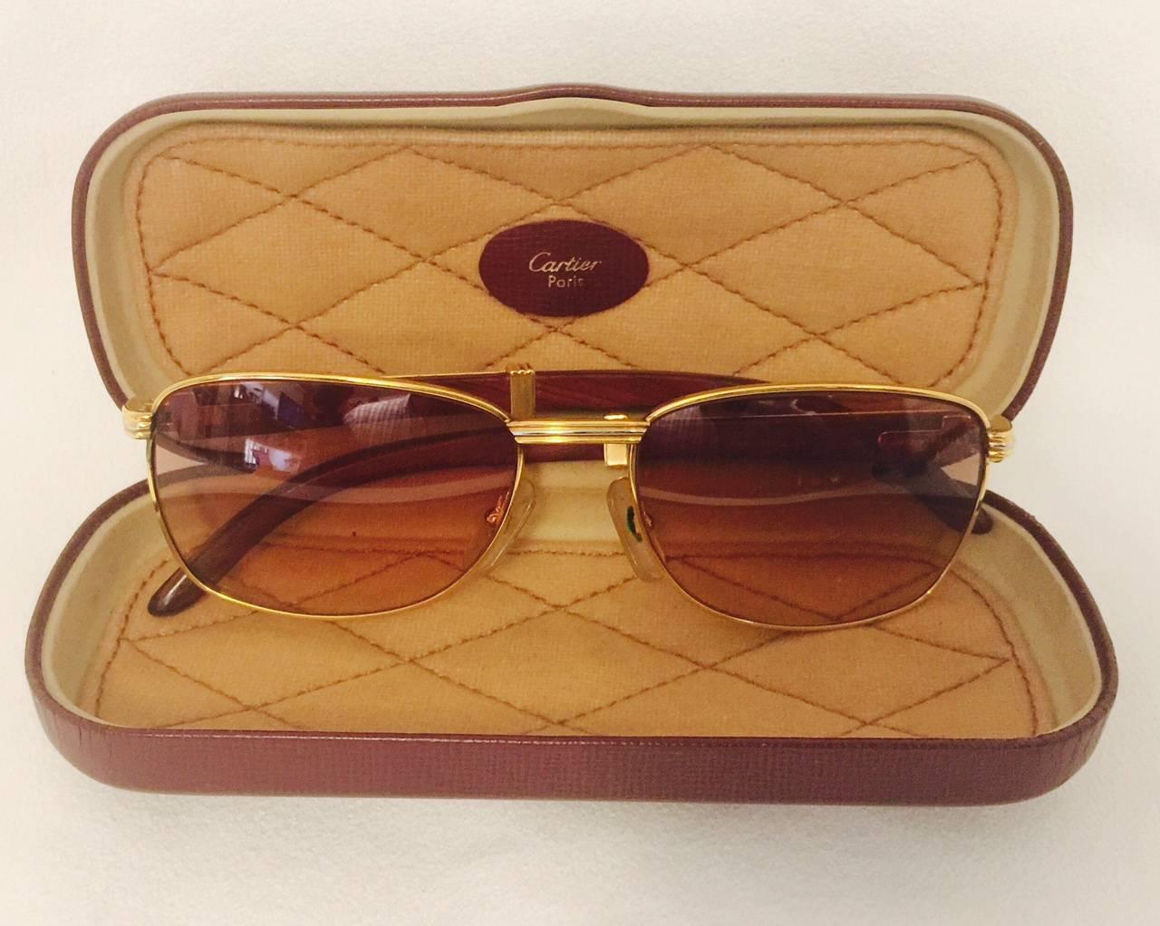 Cartier Monceau vintage sunglasses feature 18K yellow and white gold and exquisite wood and gold temples.  Outstanding only begins to describe the artistry and craftsmanship including the hallmarks - both arms sport the iconic Cartier logo. 
