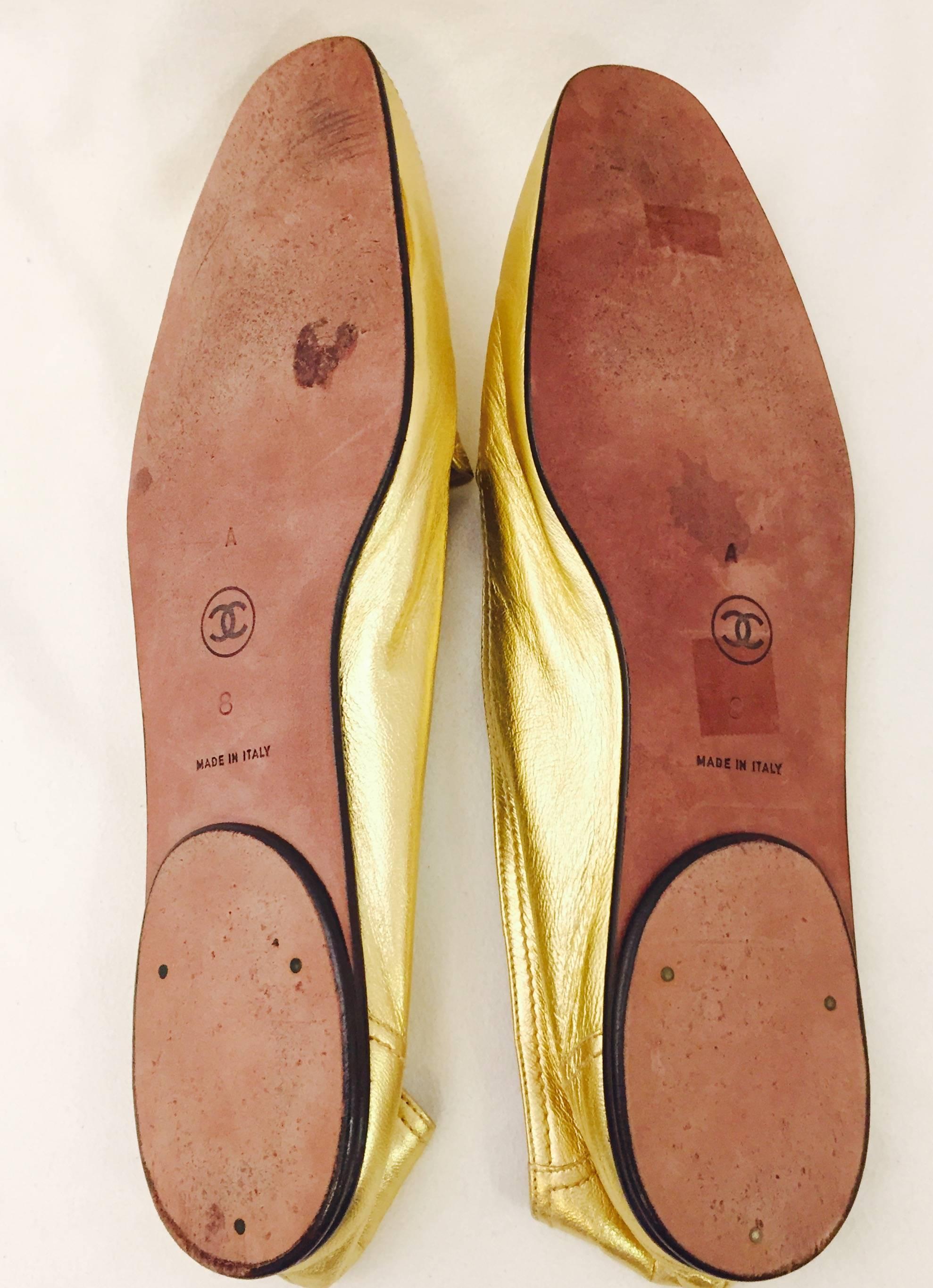 Shimmering Chanel's Metallic Gold Lambskin Loafers with CC Logo At Top  1