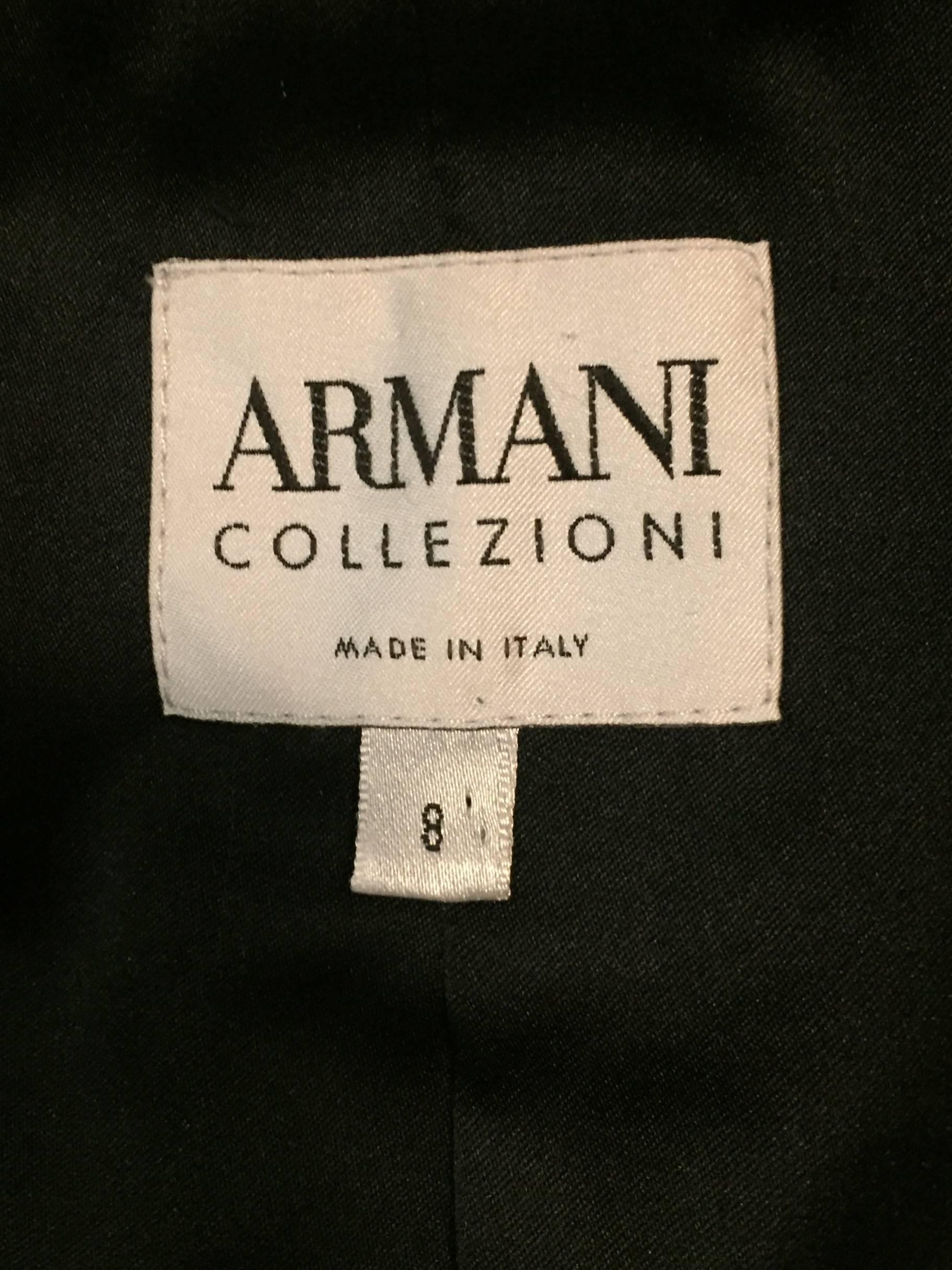 Armani Collezioni's gorgeous rich black velvet jacket features a round shawl collar and single button closure, but has another hidden button with loop below the bust for added support.  Elegant, tailored silhouette is ideal for any occasion day or